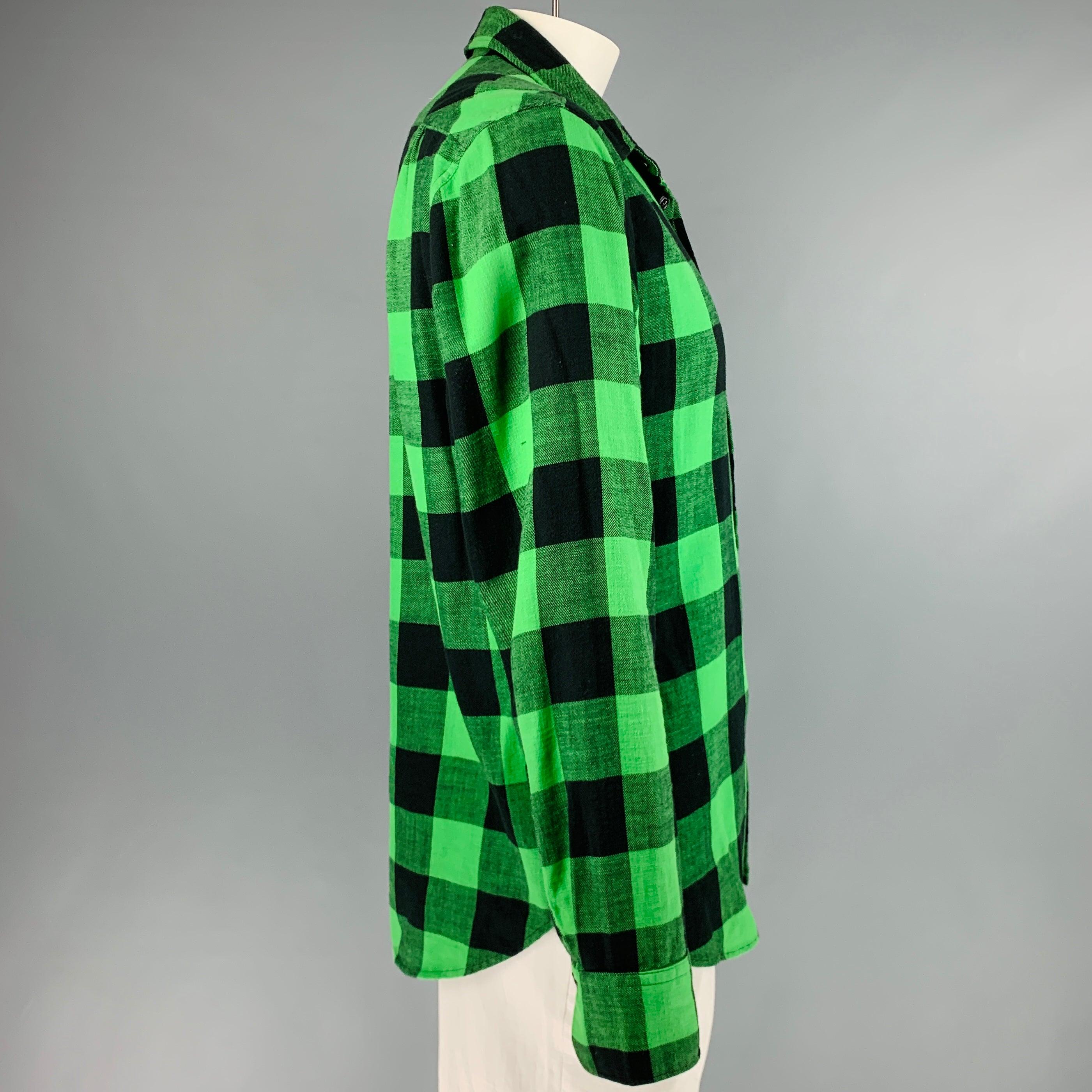 RAG & BONE long sleeve shirt
in a green and black cotton fabric featuring buffalo plaid pattern, one pocket, and a button closure. Very Good Pre-Owned Condition. Minor signs of wear. 

Marked:   L 

Measurements: 
 
Shoulder: 18 inches Chest: 43