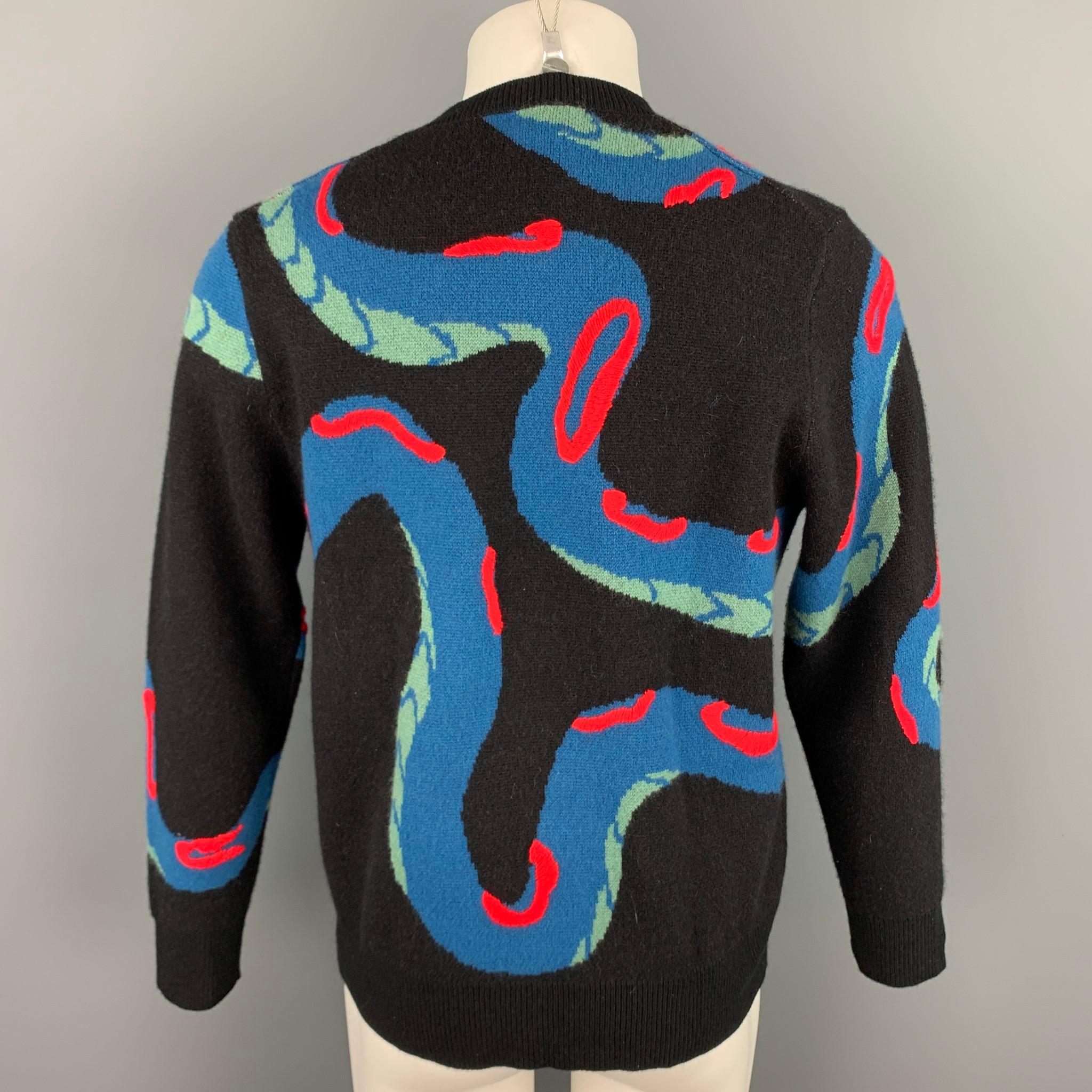 RAG & BONE sweater comes in a multi-color knitted snake cashmere featuring a button eye detail featuring a crew-neck.

Excellent Pre-Owned Condition.
Marked: M

Measurements:

Shoulder: 19 in.
Chest: 42 in.
Sleeve: 26 in.
Length: 25.5 in. 