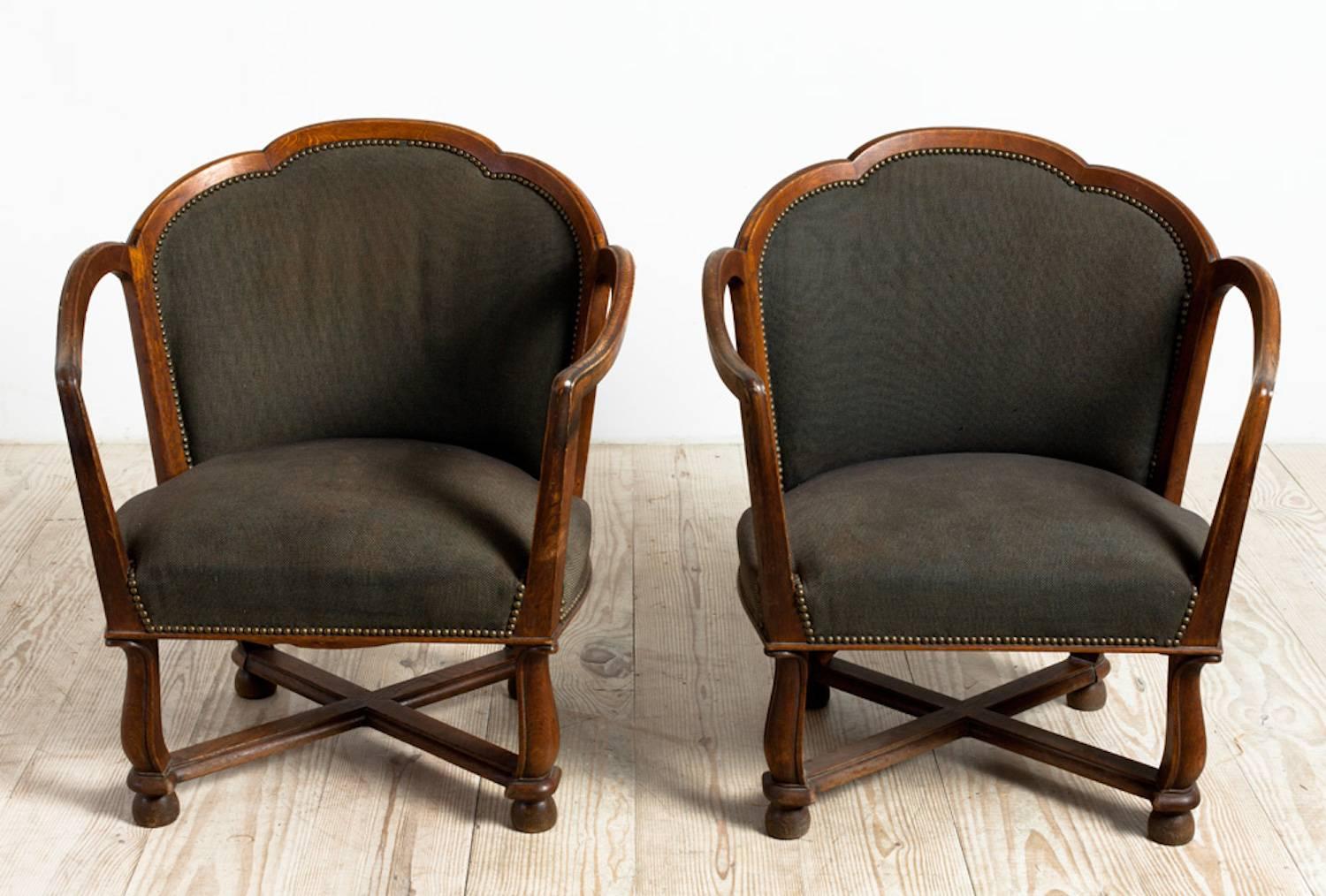 Ragnar Östman, a pair of Swedish Grace armchairs, circa 1920, origin: Sweden, oak. Very comfortable and covered in original fabric. These are beautiful examples of Nordic Classicism. 
