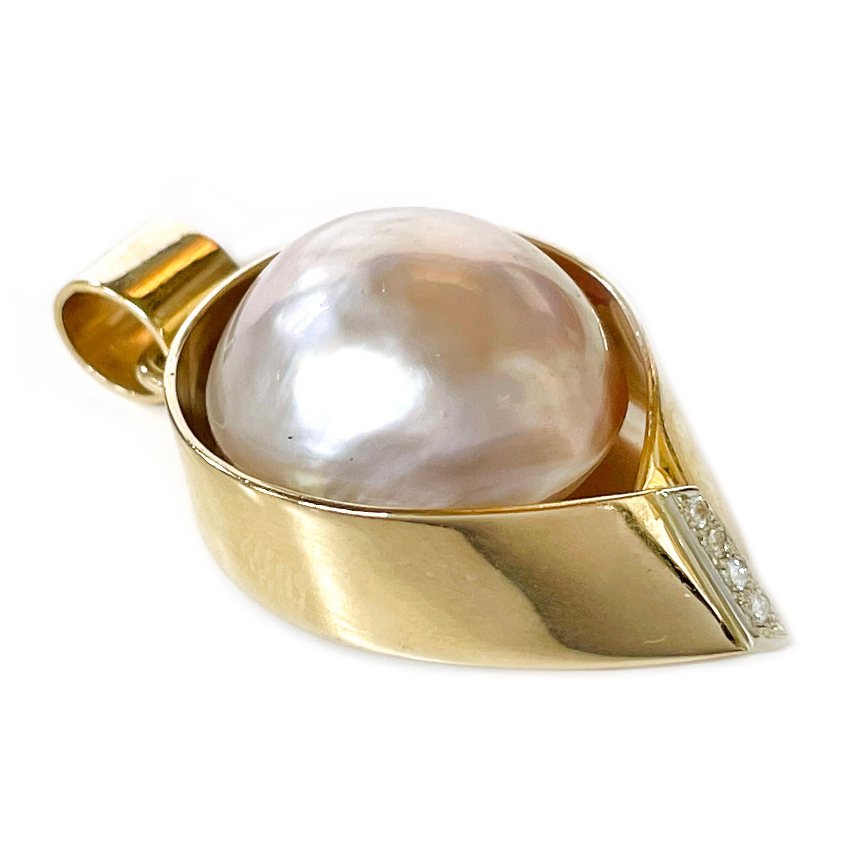 Ragnar Rose Gold Mabe Pearl Diamond Pendant. The pendant features a pink Mabe pearl set in a special open bezel and four melee diamonds. The pearl has good luster and hues of pink with white on the bottom. The diamonds are bead-set in white gold on