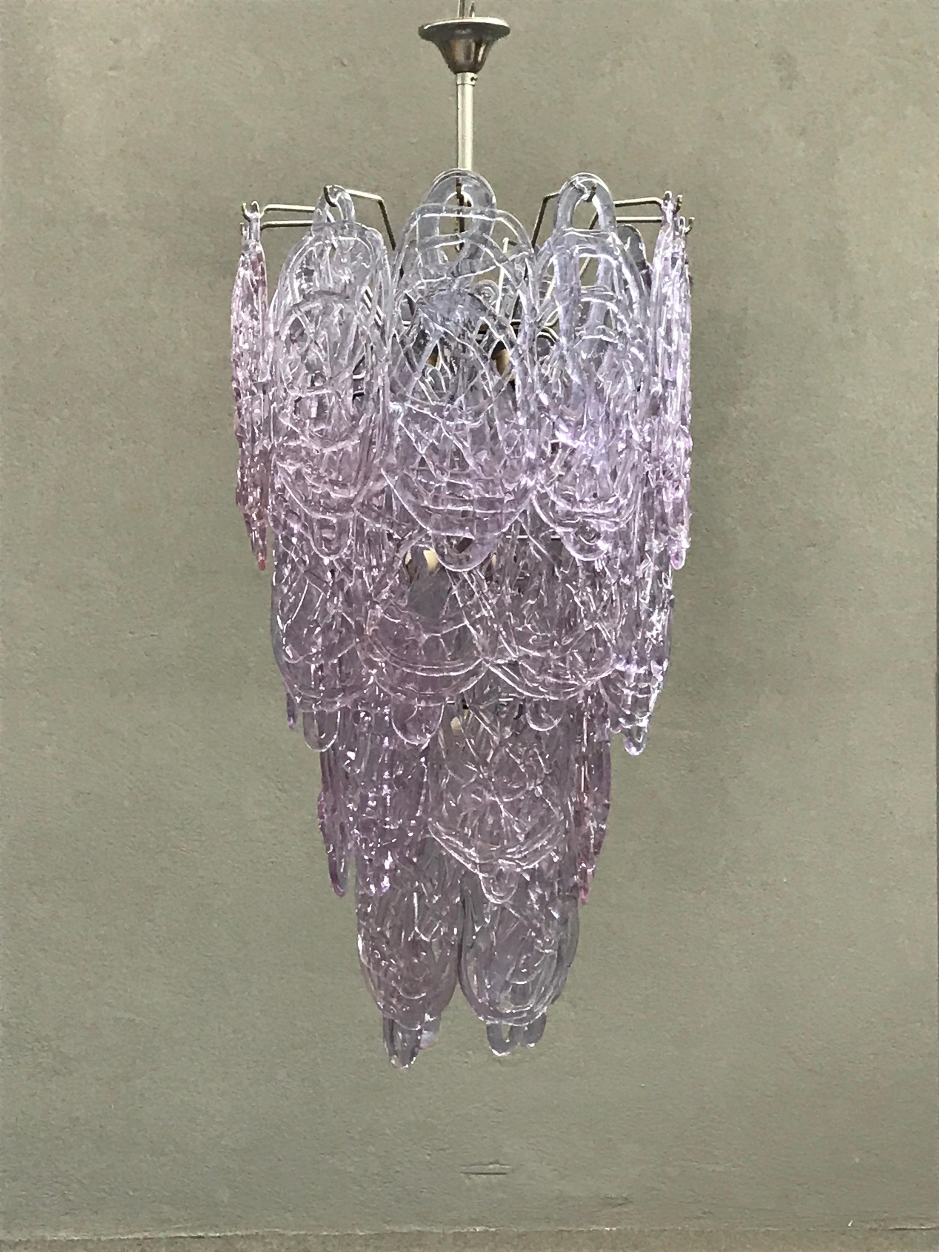 Stunning Murano glass chandelier by Mazzega. Metal frame and 31 glasses.
Each glass is individually handblown. Four tiers and seven lights.
