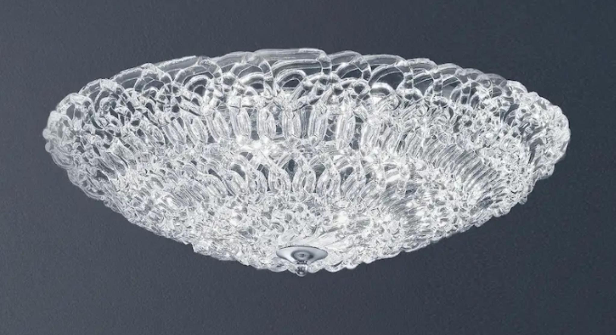 Italian flush mount with clear Murano glasses hand blown to form an organic cobweb texture, mounted on chrome finish frame / Made in Italy
4 lights / G9 type / max 40W each
Measures: Diameter 23.5 inches / height 5 inches
Order only / This item