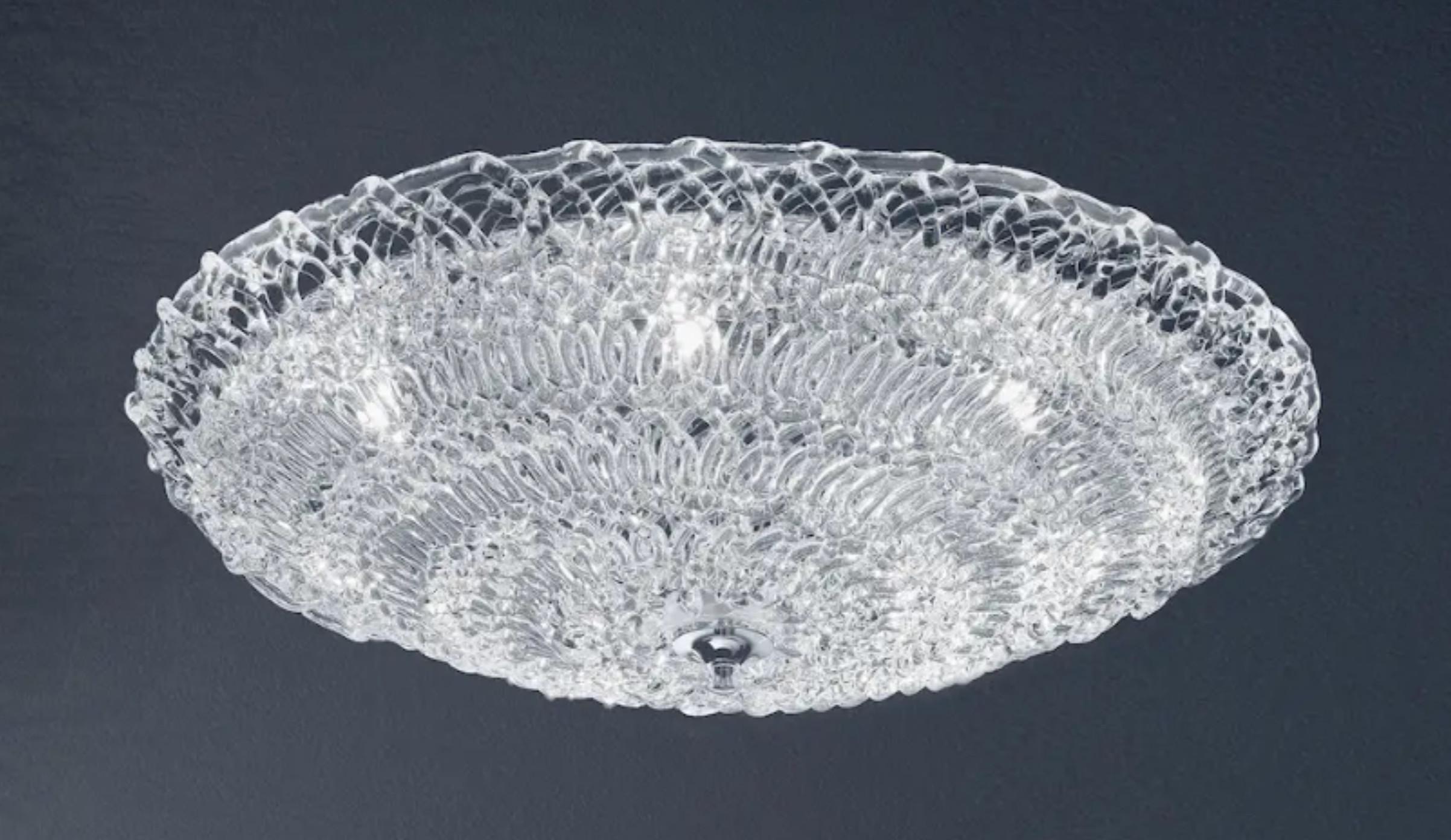 Italian flush mount with clear Murano glasses hand blown to form an organic cobweb texture, mounted on chrome finish frame / Made in Italy
6 lights / G9 type / max 40W each
Measures: Diameter 31.5 inches / height 6 inches
Order only / This item