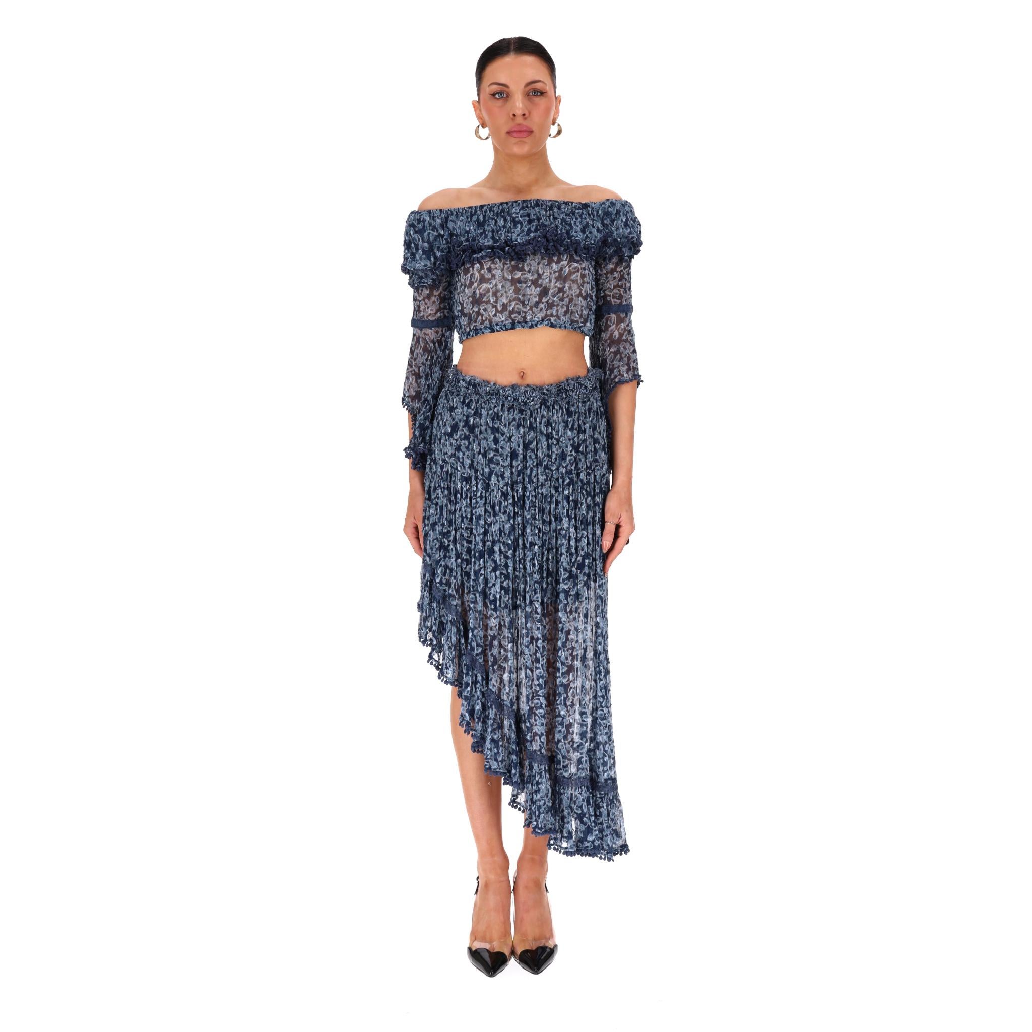 Rahi Cali Off-The-Shoulder Top & Asymmetric Skirt Two-Piece Set

Navy set designed with a floral print and consisting of a cropped, off-the-shoulder top and asymmetric midi skirt.

Embellished with ruffle trims and flouncy design.

Rrp Approx.