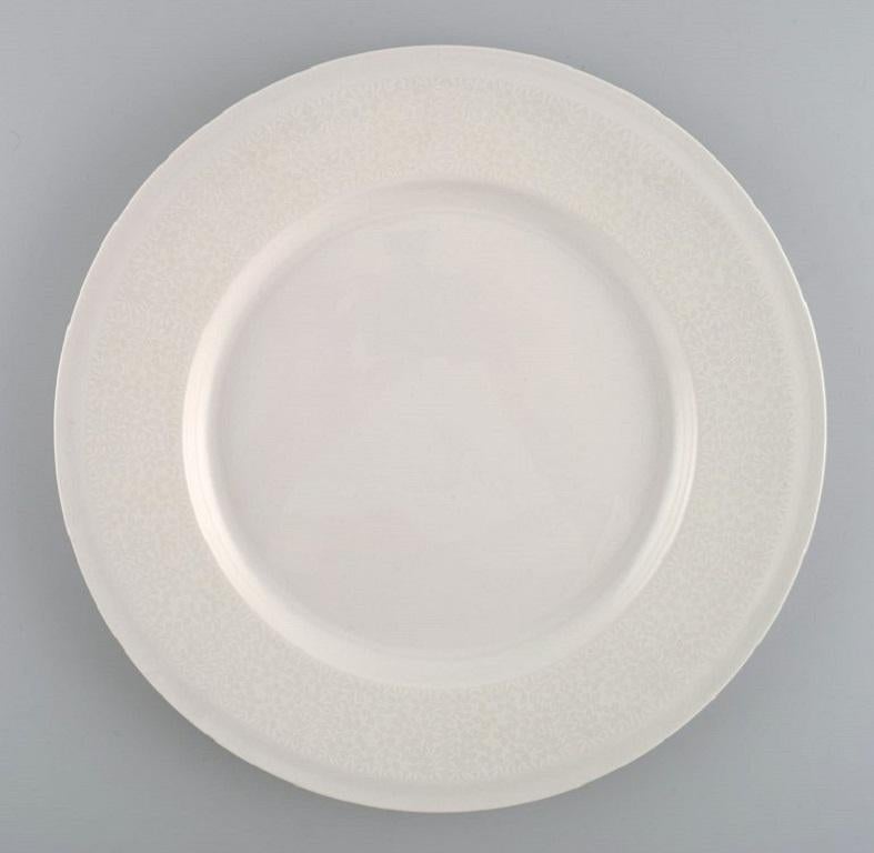 Raija Uosikkinen for Arabia. 10 rare Pitsi dinner plates with floral decoration. 
Dated 1967-1974.
Diameter: 26 cm.
In excellent condition.
Stamped.
