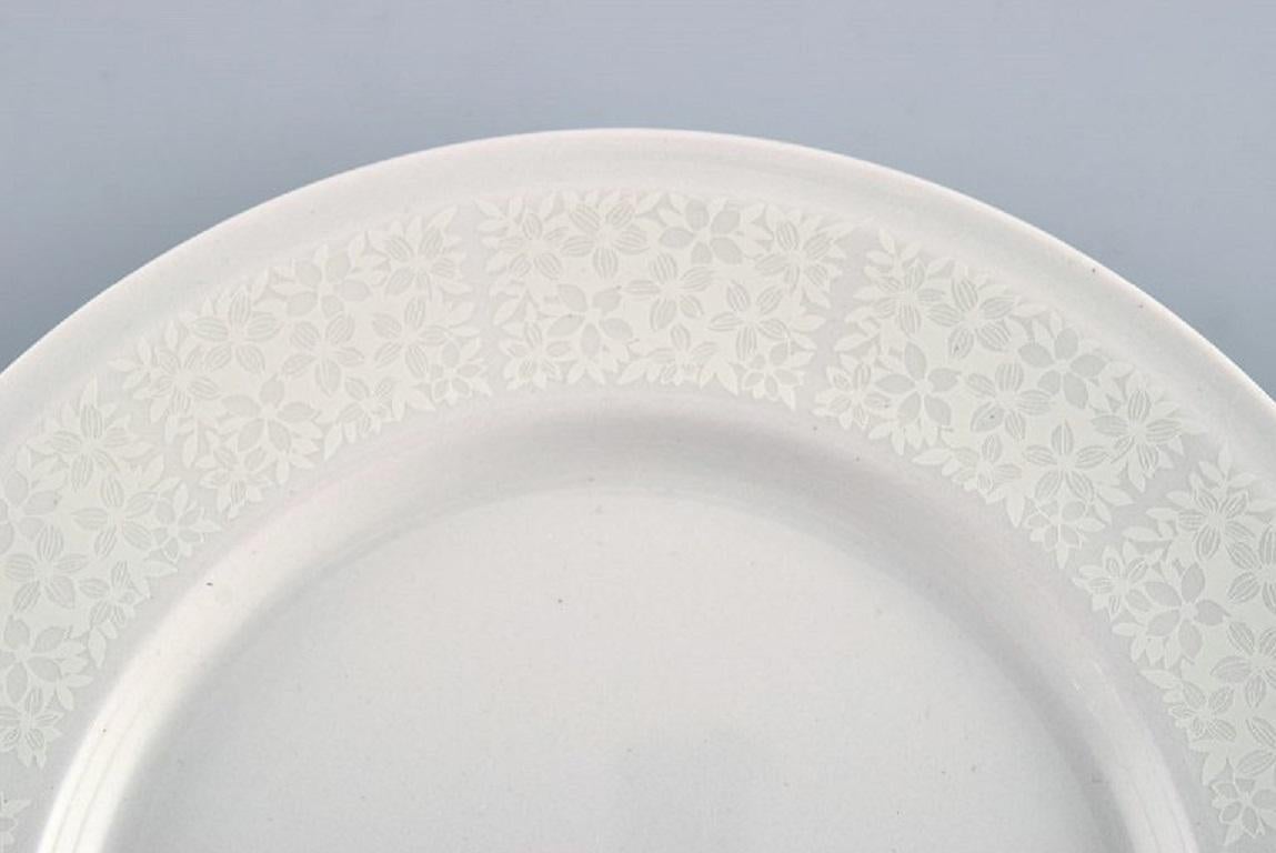Finnish Raija Uosikkinen for Arabia. 11 rare Pitsi side plates with floral decoration. For Sale