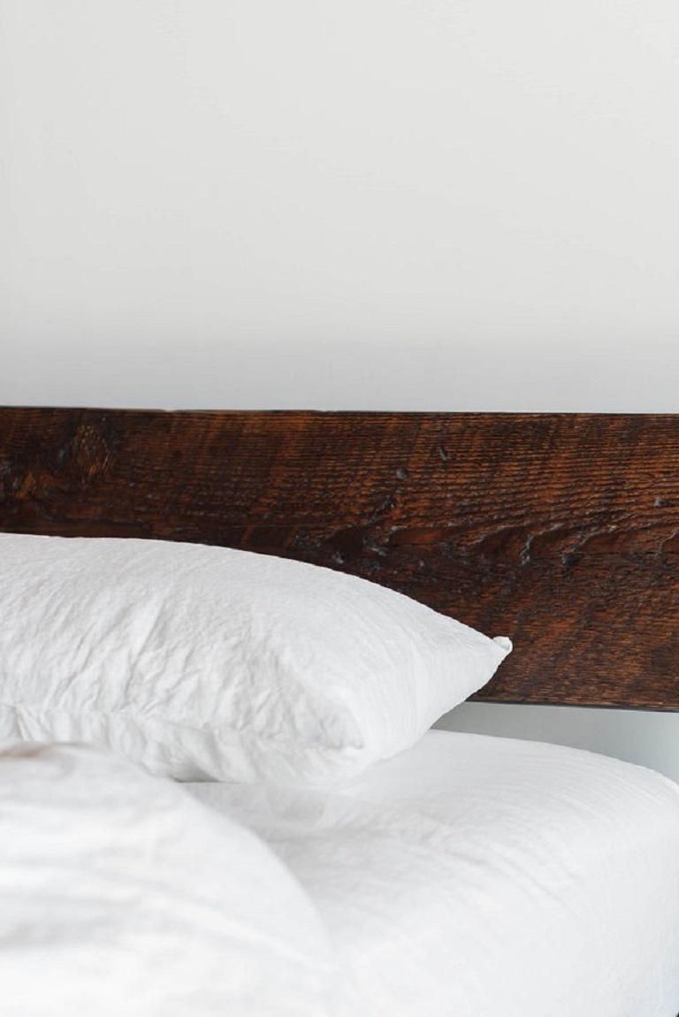 The Railcar Platform Bed is a modern take on a classic design. Crafted from reclaimed wood sourced from Southern California architecture, each piece is unique with its own character and history. The sleek platform design and minimalist frame create