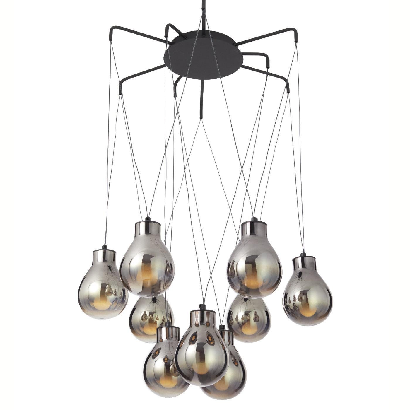 Like raindrops dancing through an autumn sky, this magnificent chandelier features nine spectacular bulbs handcrafted of polished and mirrored glass, enhanced with a warm and smokey red hue. Suspended on V-shaped threads, it features a matte black