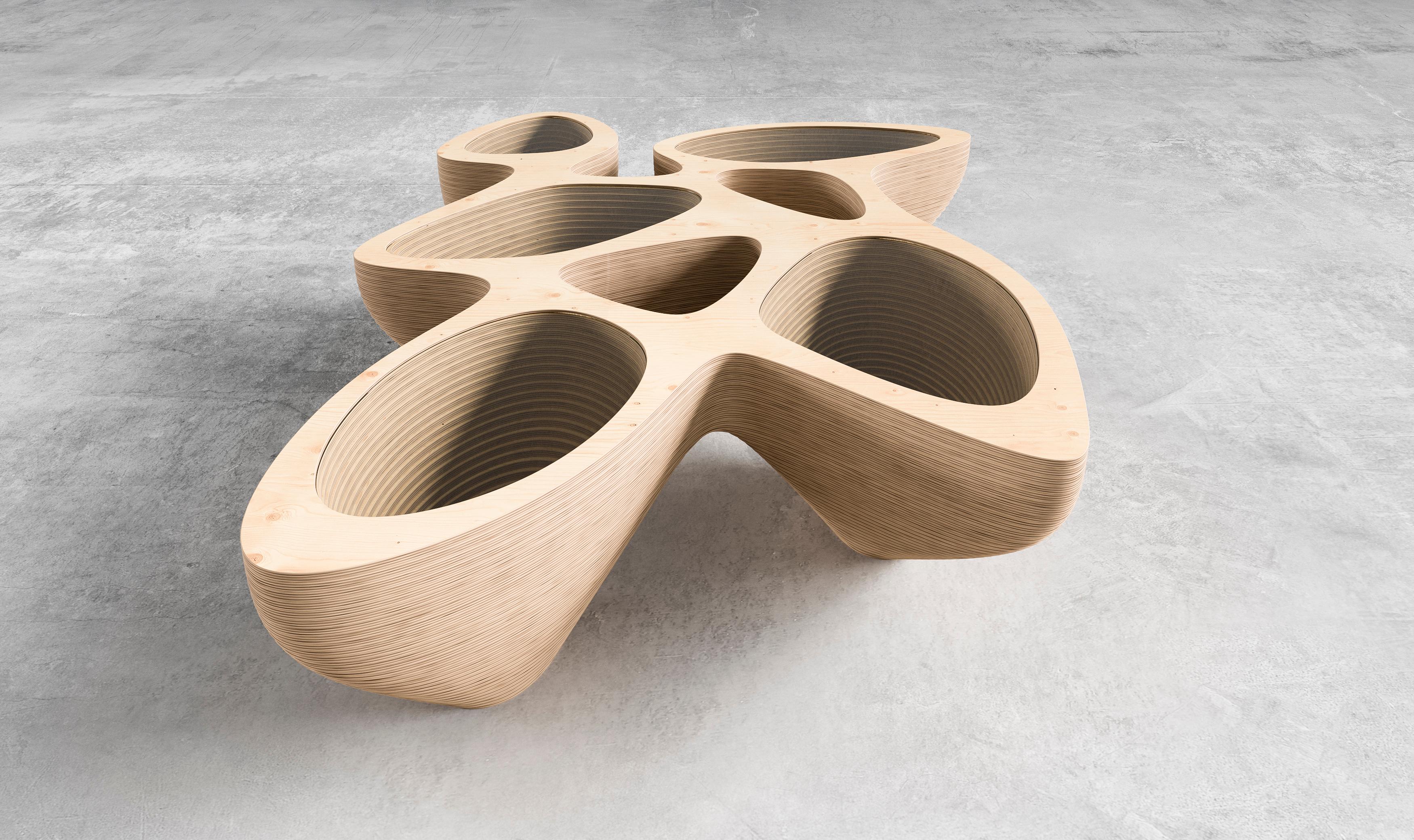 Table basse Rain Gatherer - Une pièce d'apparat pour les espaces modernes
Faites entrer la nature dans votre maison avec la table basse Rain Gatherer, un meuble en contreplaqué magnifiquement fabriqué qui allie harmonieusement fonctionnalité et