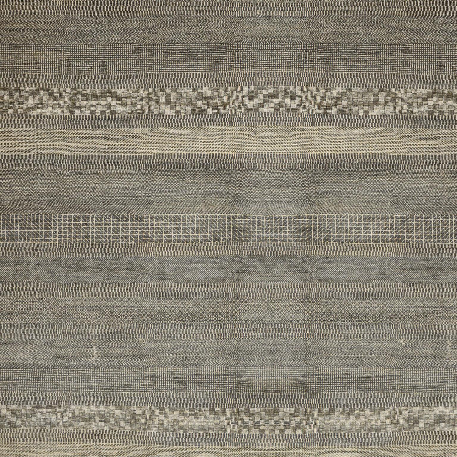 This 10’ x 13’11' Orley Shabahang signature “Rain” carpet showcases a modern design in a hand knotted Persian weave. This carpet, from the Orley Shabahang Rain collection, features a simple pattern made from pure handspun wool and organic dyes that