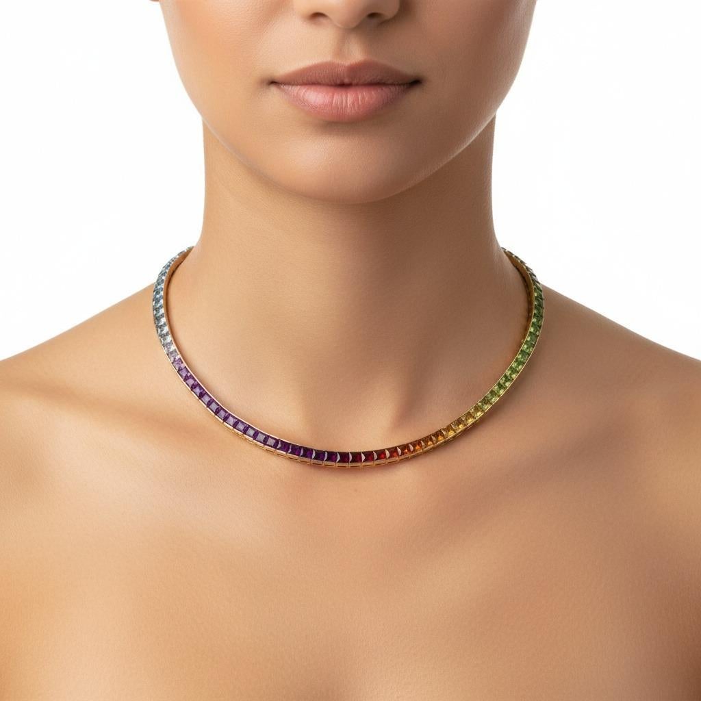 This gorgeous and outstanding rainbow necklace showcases exceptional contemporary craftsmanship, expertly crafted in lustrous 18kt yellow gold and accented with 92 calibrated fine gemstones faceted in the sophisticated French-cut shape. The