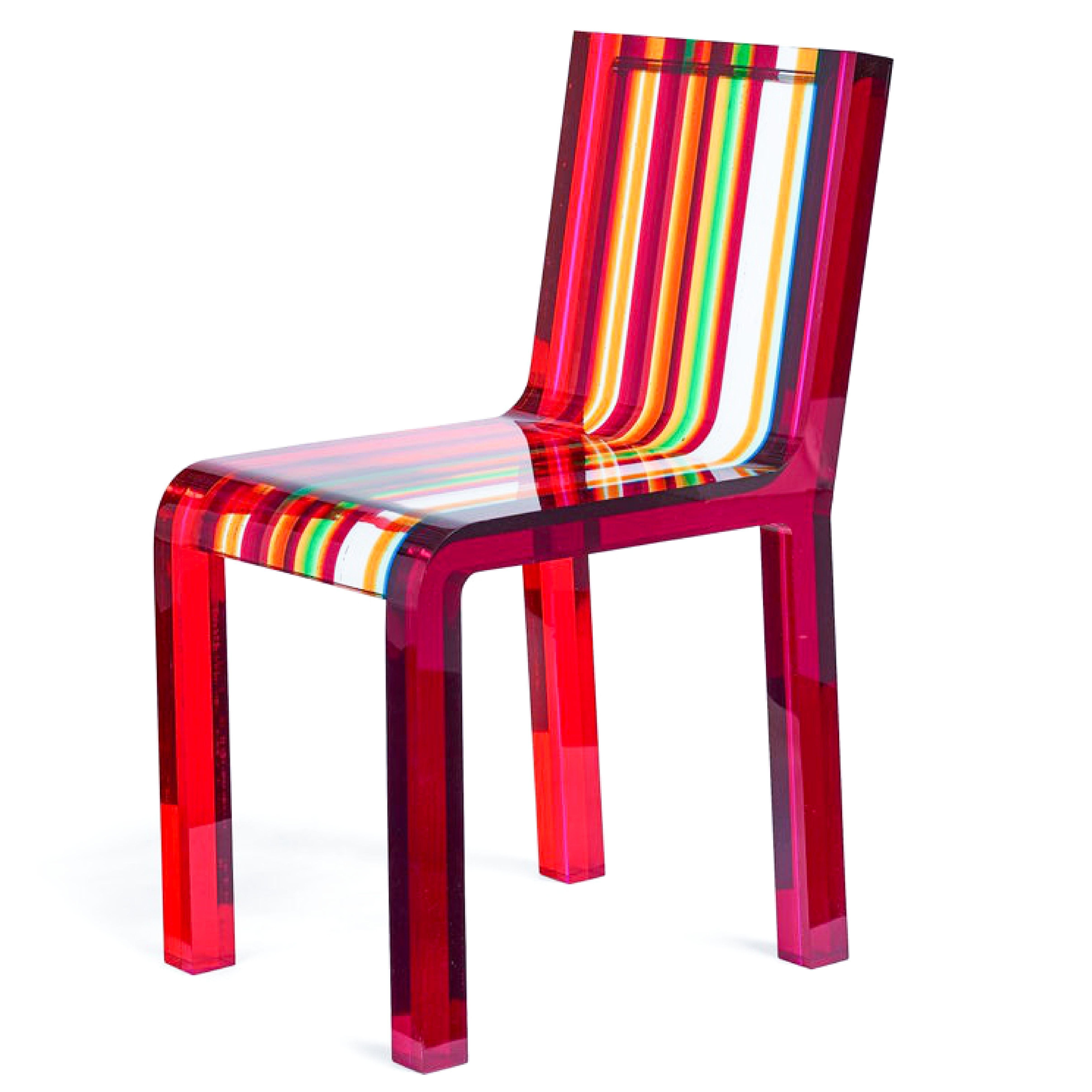 The amazing Rainbow chair by Norguet delivers an elegant shape while making a statement with bold colors. It is manufactured entirely in acrylic resin and consists of plates of different colors and thicknesses joined together by ultrasound. A