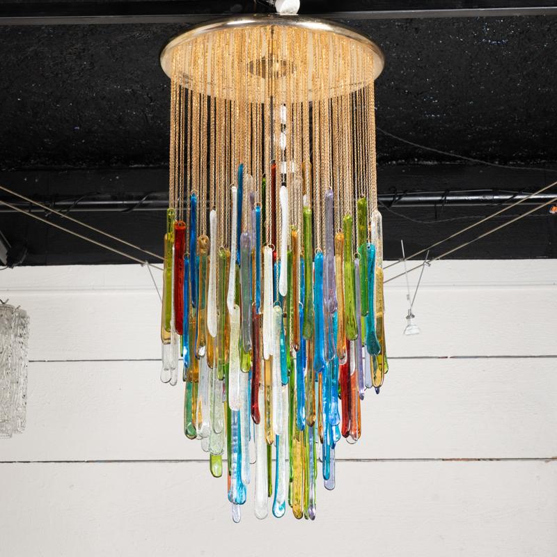 Rainbow Chandelier gilded brass structure and pendants in paste of multicolored Murano glasses
Fully restored and electrified.
Italian design of the 70s.

Height 90cm - 35,4 po
Diameter 45 cm - 17,7 po