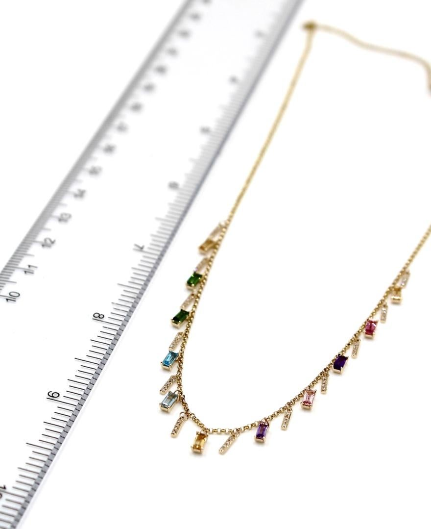 Colorful rainbow layering necklace made of 14K yellow gold.  The necklace is furnished with round diamonds weighing 0.15 carats total and multicolor semi precious baguette gems weighing 1.26 carats total.

-  Freely adjustable: Can be worn up to 18
