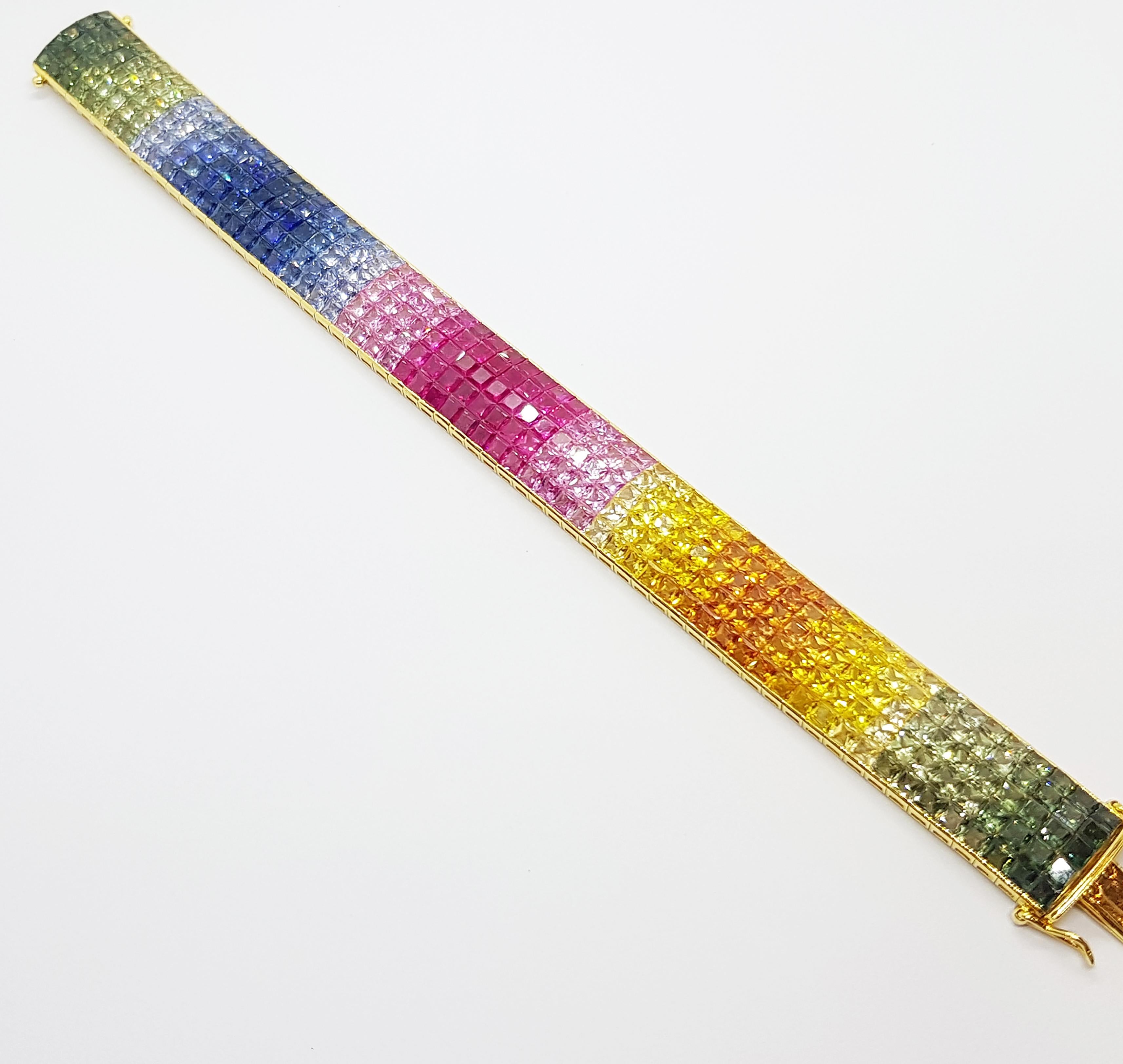 Rainbow Colour Sapphire 58.90 carats Bracelet set in 18 Karat Gold Settings

Width:  1.5 cm 
Length: 17.9 cm
Total Weight: 47.39 grams

