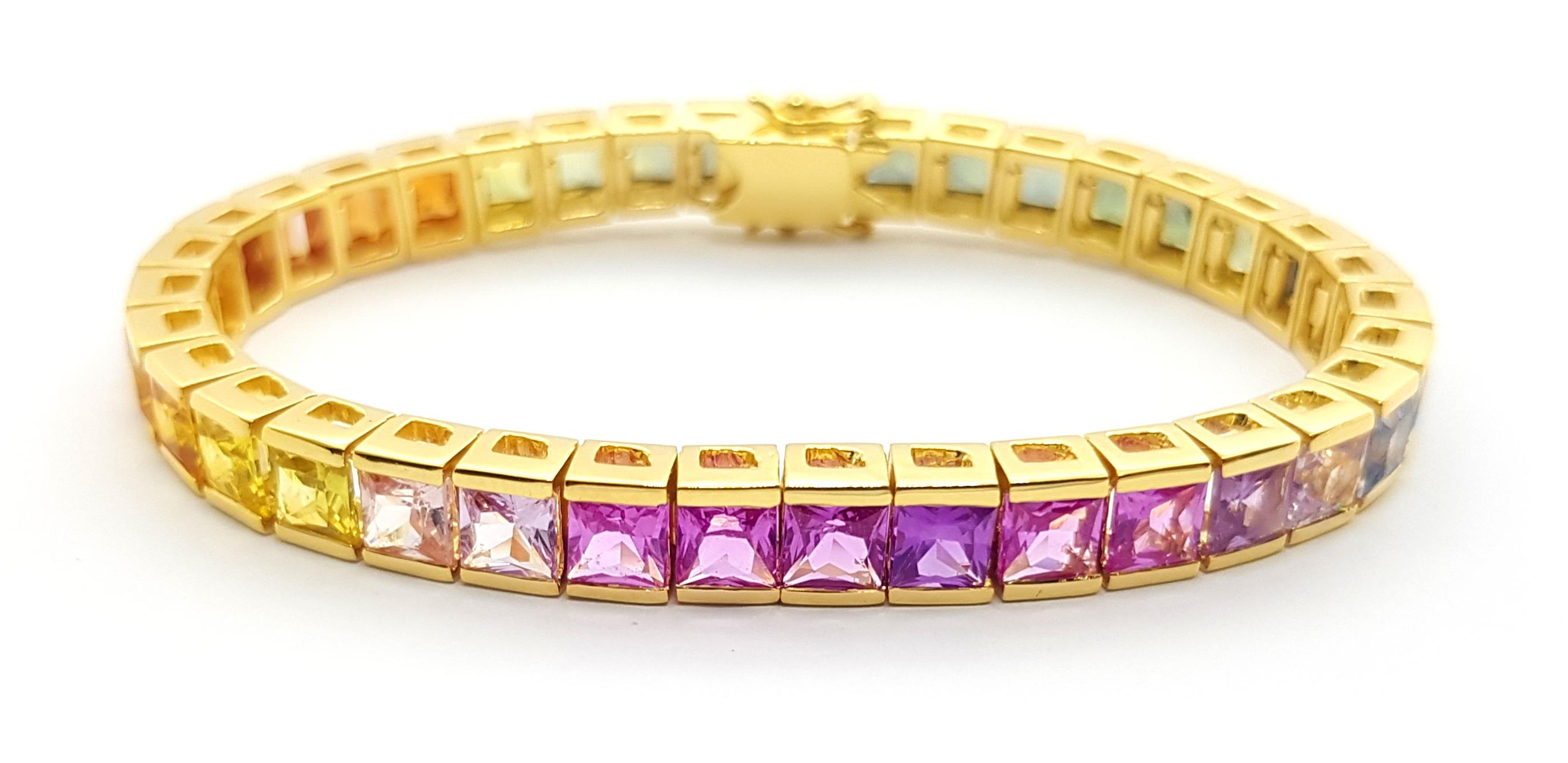 Rainbow Colour Sapphire 24.50 carats Bracelet set in 18K Gold Settings

Width:  0.6 cm 
Length: 17.6 cm
Total Weight: 37.25 grams


