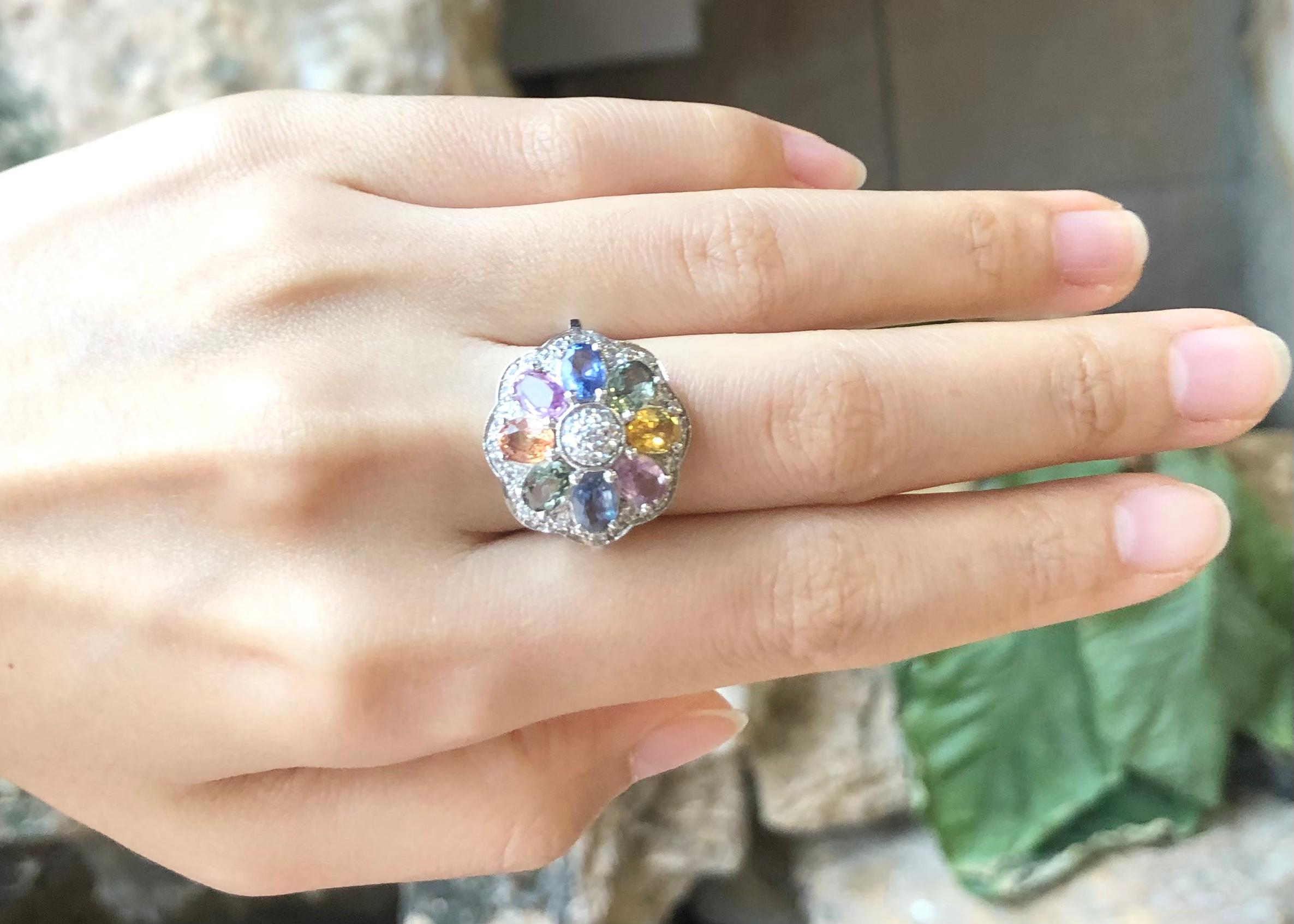 Rainbow Colour Sapphire with Cubic Zirconia Ring set in Silver Settings

Width:  2.0 cm 
Length: 2.0 cm
Ring Size: 54
Total Weight: 7.2 grams

*Please note that the silver setting is plated with rhodium to promote shine and help prevent oxidation. 