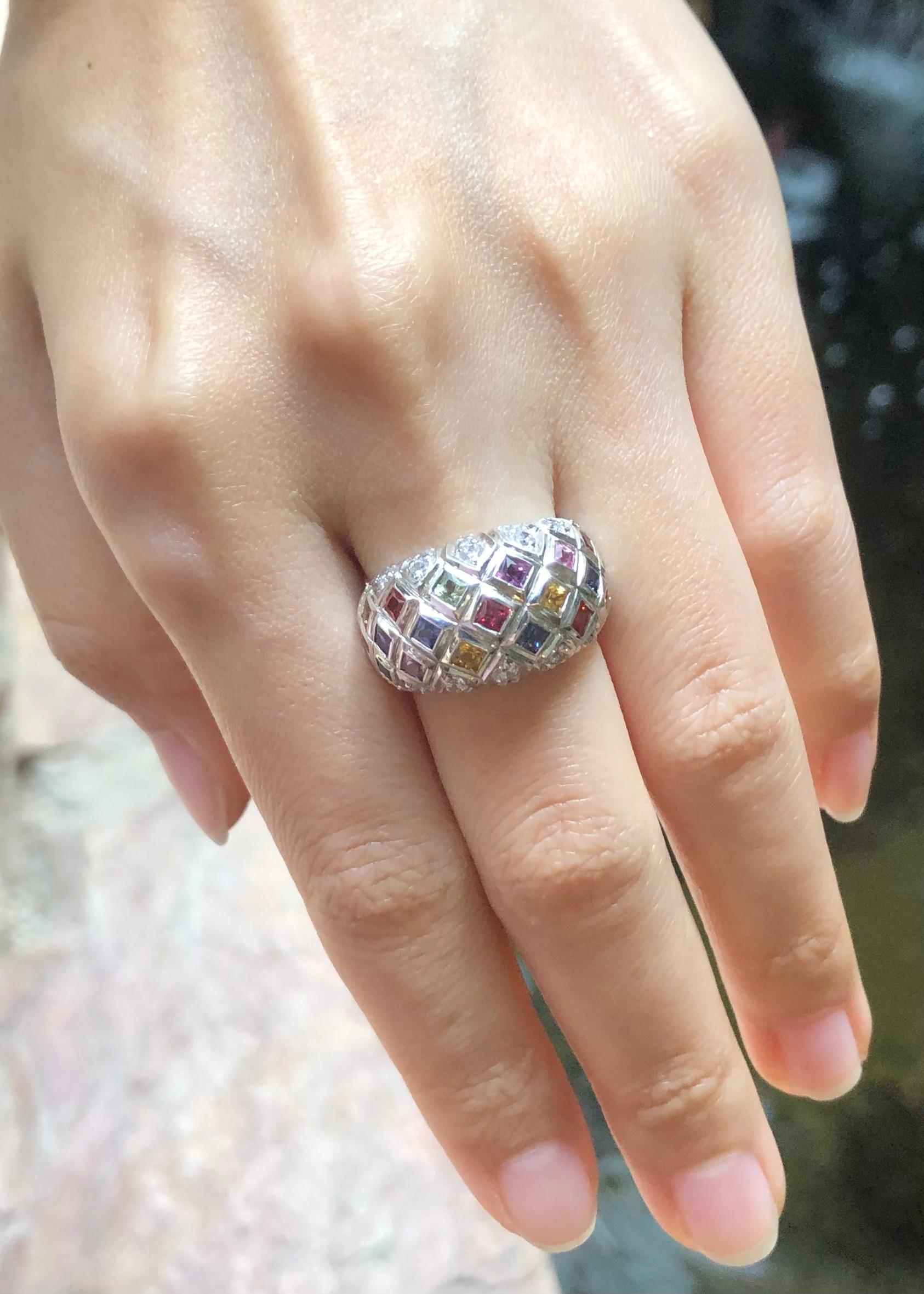 Rainbow Colour Sapphire  with Cubic Zirconia Ring set in Silver Settings

Width:  2.2 cm 
Length: 1.3 cm
Ring Size: 54
Total Weight: 7.36 grams

*Please note that the silver setting is plated with rhodium to promote shine and help prevent oxidation.