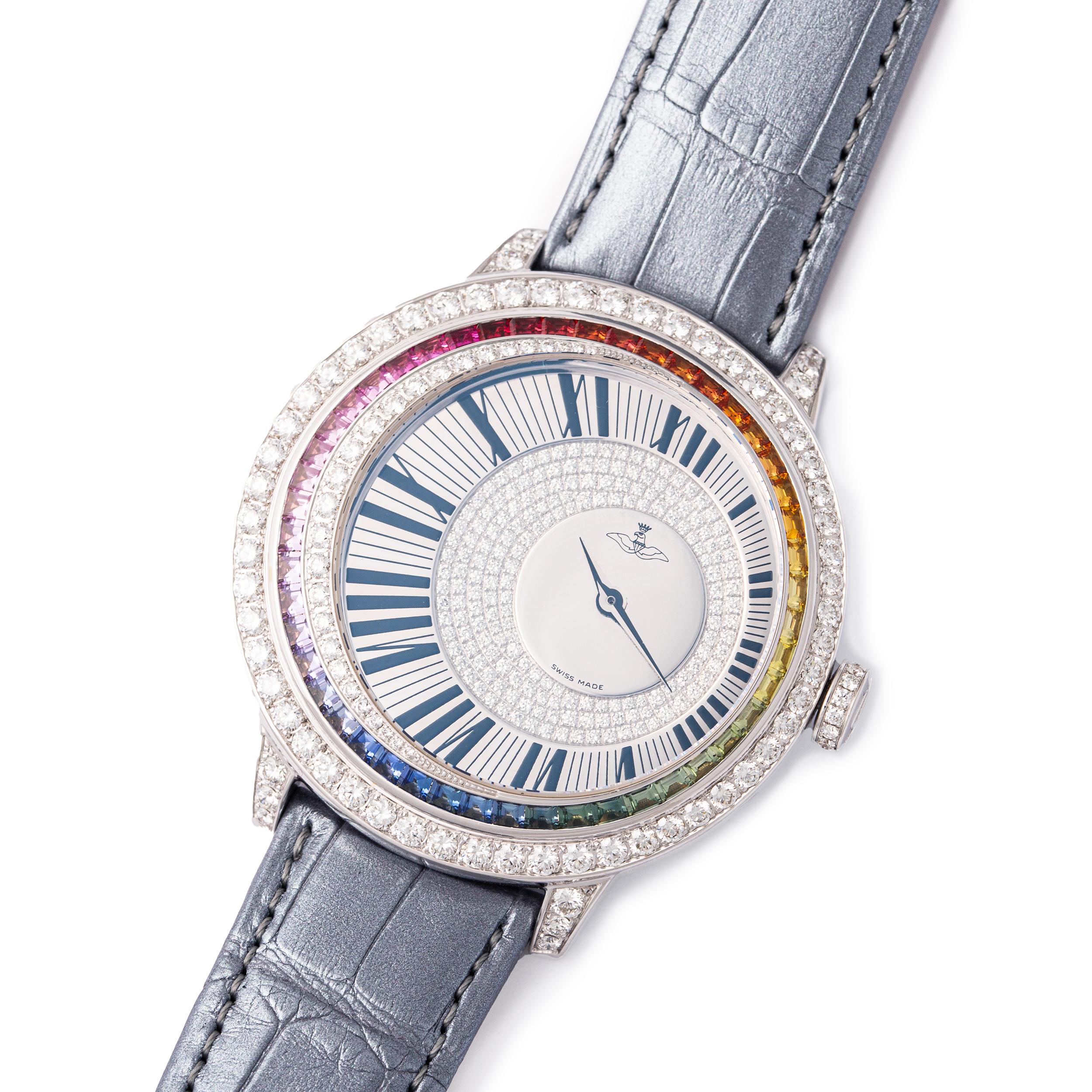 Watch in white gold 18kt set with 48 Rainbow sapphires 2.98 cts on bezel case dial set with 288 diamonds 3.85 cts and prong buckle alligator strap quartz movement. 