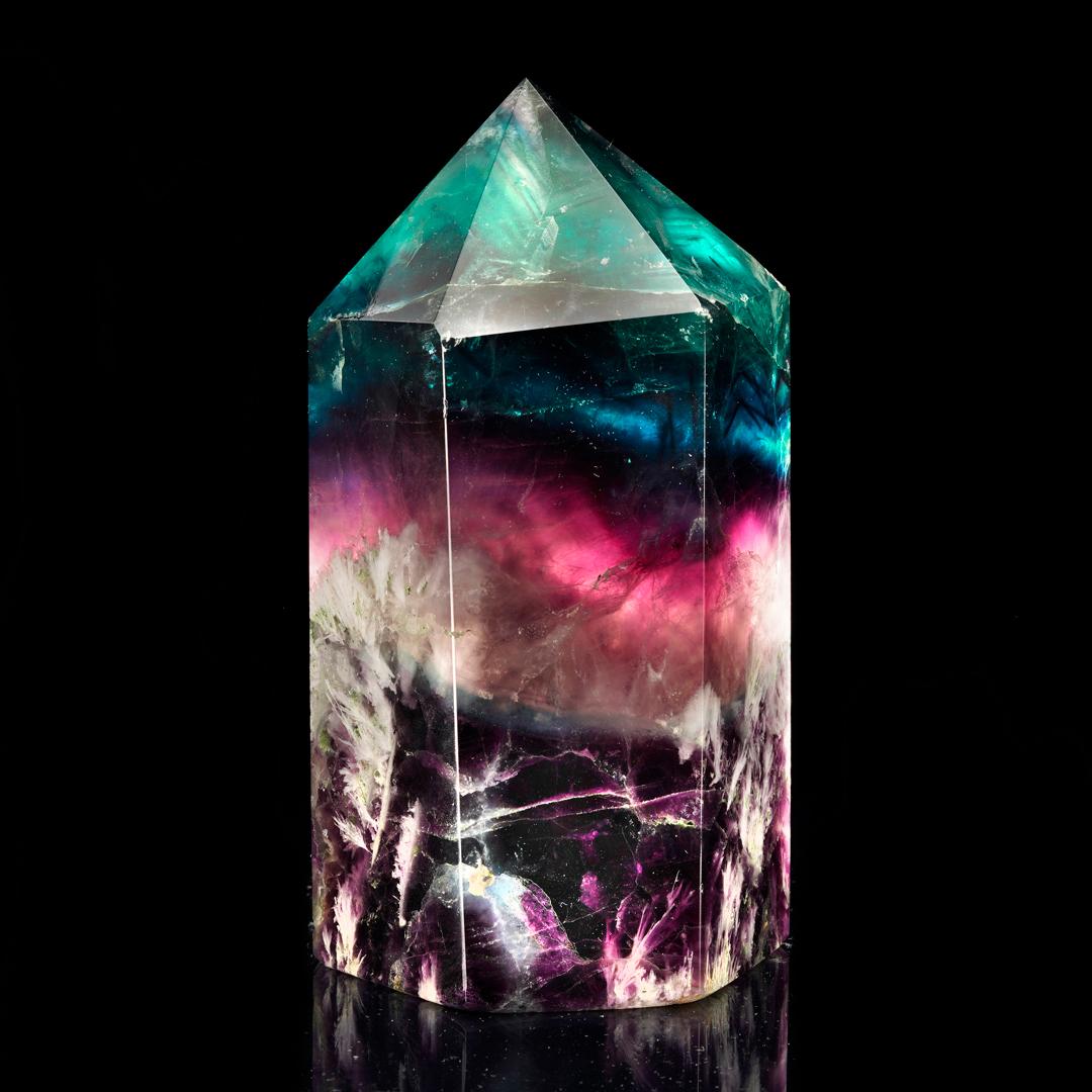This mesmerizingly swirled and banded deeply pigmented, brightly rainbow colored fluorite tower from China has been hand-carved out of excellent quality crystal and polished to a brilliant luster. It weighs a substantial 4.60 pounds and displays