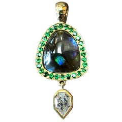 Rainbow garnet and tsavorite necklace in 18 k gold with a GIA empress diamond