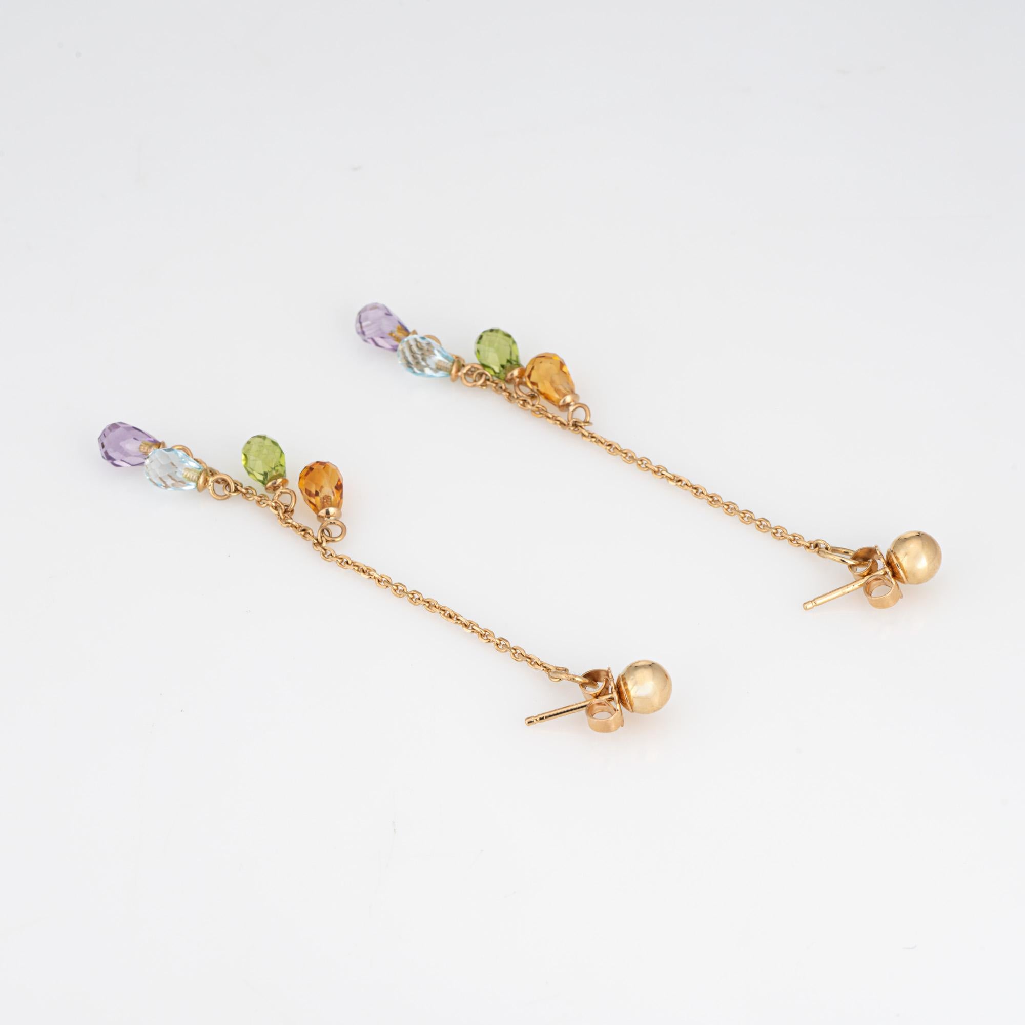 Fine detailed pair of semi precious rainbow gemstone drops crafted in 14k yellow gold. 

Briolette faceted blue topaz, citrine, amethyst and peridot measure 4mm each.
The stylish earrings feature briolette faceted stones that shimmer with every