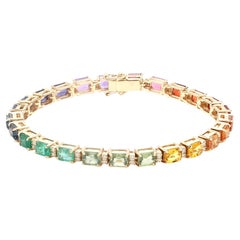Bracciale Rainbow con gemme taglio smeraldo e diamanti in oro 18 carati