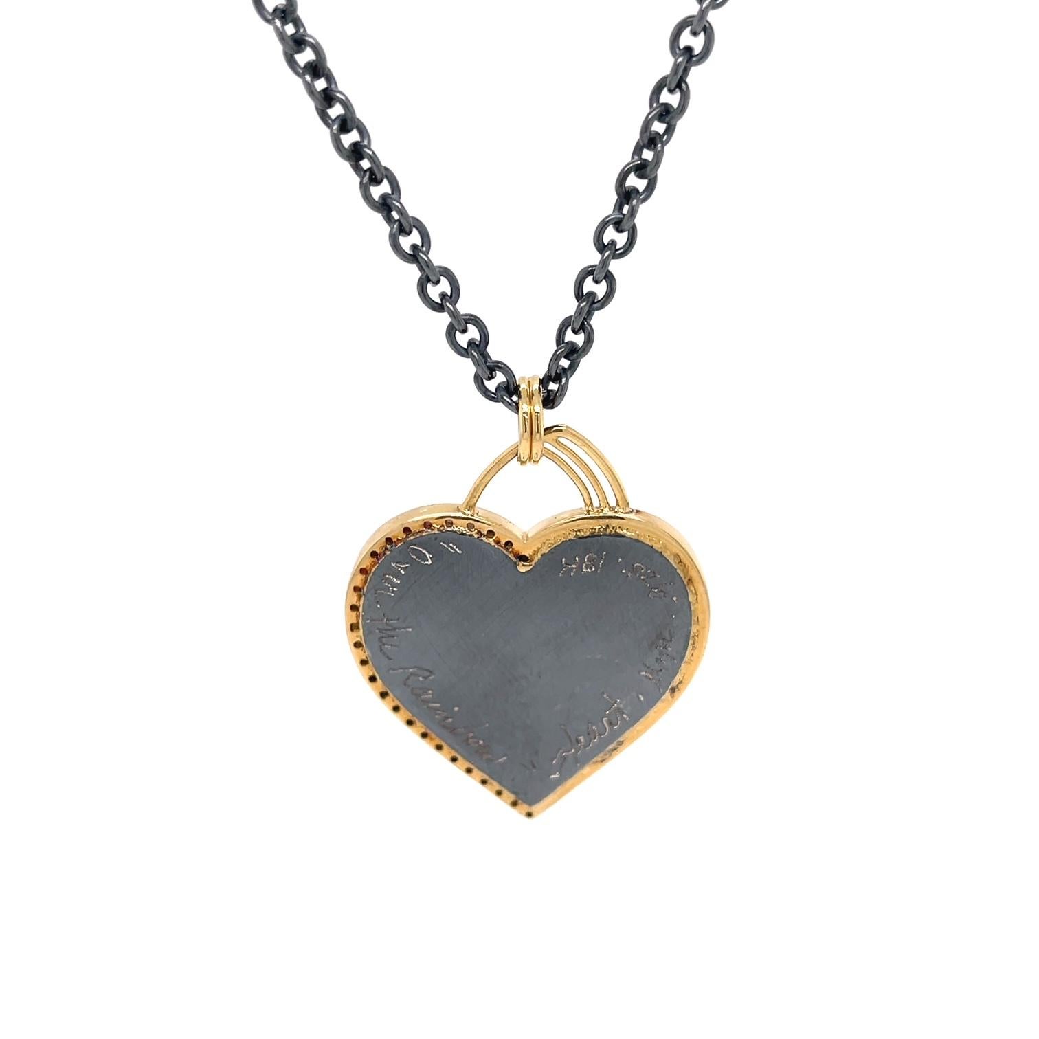 An oxidized sterling silver, 18k yellow gold and rusted iron, 2022 unbreakable heart necklace entitled 