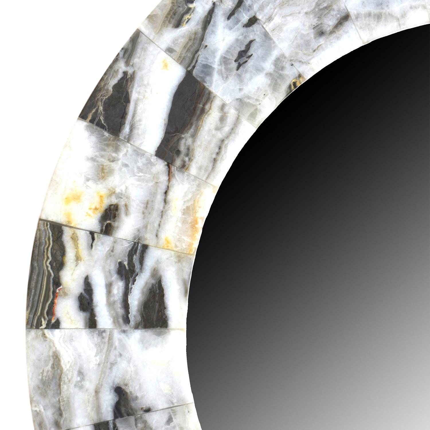 Rectangular mirror with thick frame made from Onyx.
Onyx Mirrors

Although there are a few other places in the world where the semi-precious stone Onyx exist, we found our collection in Mexico.

A Bit of Information on the Semi-Precious Stone