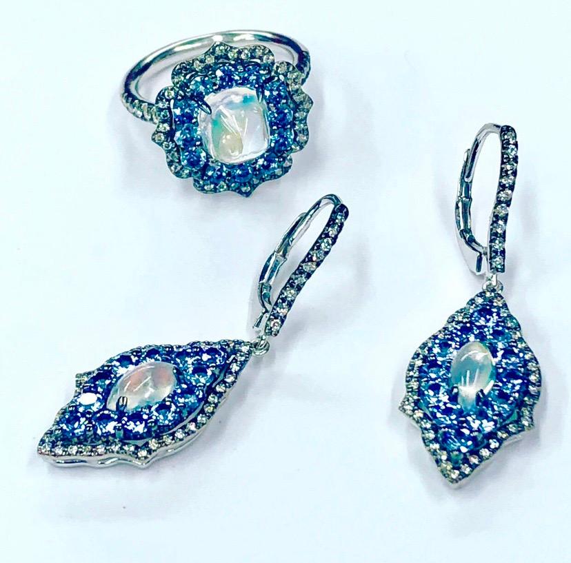 Rainbow Moonstone Marquis centers are surrounded by Denim Blue Sapphires and Accented By Colorless Diamonds, in 18 K White Gold, perfect earrings for the Bride.
Rainbow Moonstones 3.00 CT’s
Blue Sapphires .96 CT’s 
Diamonds .60 CT’s 