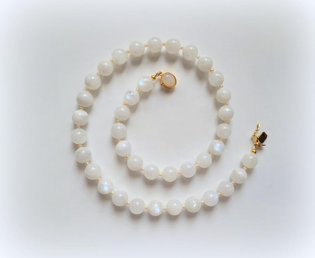 The necklace is 19 inches (48 cm) long. The smooth round beads are 10 mm in size. Rainbow Moonstone is mined in the Sri Lanka.
Beads have a delightfully soft, gentle, uniform tone with an inner blue shimmer.
Authentic, natural color. No thermal or