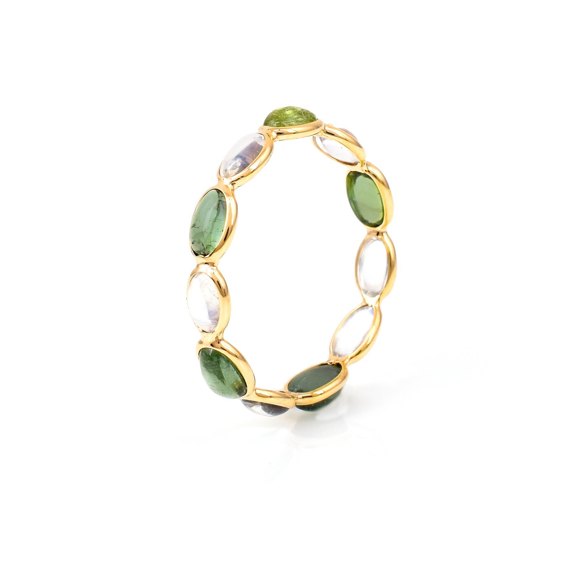 Shape: Oval Cabochon

Stones: Rainbow Moonstone and Green Tourmaline 

Metal: 14 Karat Yellow Gold (can be customized)

Style: Single Line Band

Ring Size: US 7 (can be customized)

Stone Weight: appx. 3.25carats of Opal and Pink Tourmaline 

Total