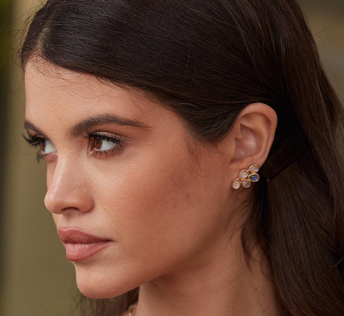 Tresor Beautiful Earring feature 3.79 carats of Rainbow Moonstone. The Earring is an ode to the luxurious yet classic beauty with sparkly gemstones and feminine hues. Their contemporary and modern design make them perfect and versatile to be worn at