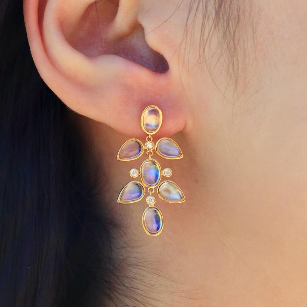 Radiant and ethereal, the Nina Zhou Rainbow Moonstone & Diamond Chandelier Drop Earrings capture the mystical beauty of the moon. The moonstone’s unique rainbow hue shimmers with an enchanting glow, symbolizing the moon’s strength and its protective