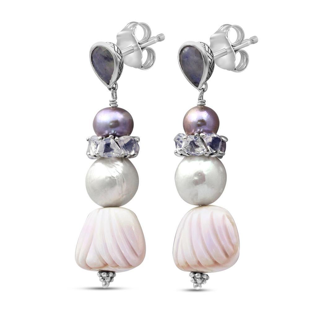 Rainbow Moonstone, Natural Pearls, and Lavender Moonstone Drop Earring

Stephen’s heart and passion go into each Dweck design, as the placement of each stone and its connection to nature has meaning. While bold and opulent, his jewelry has a