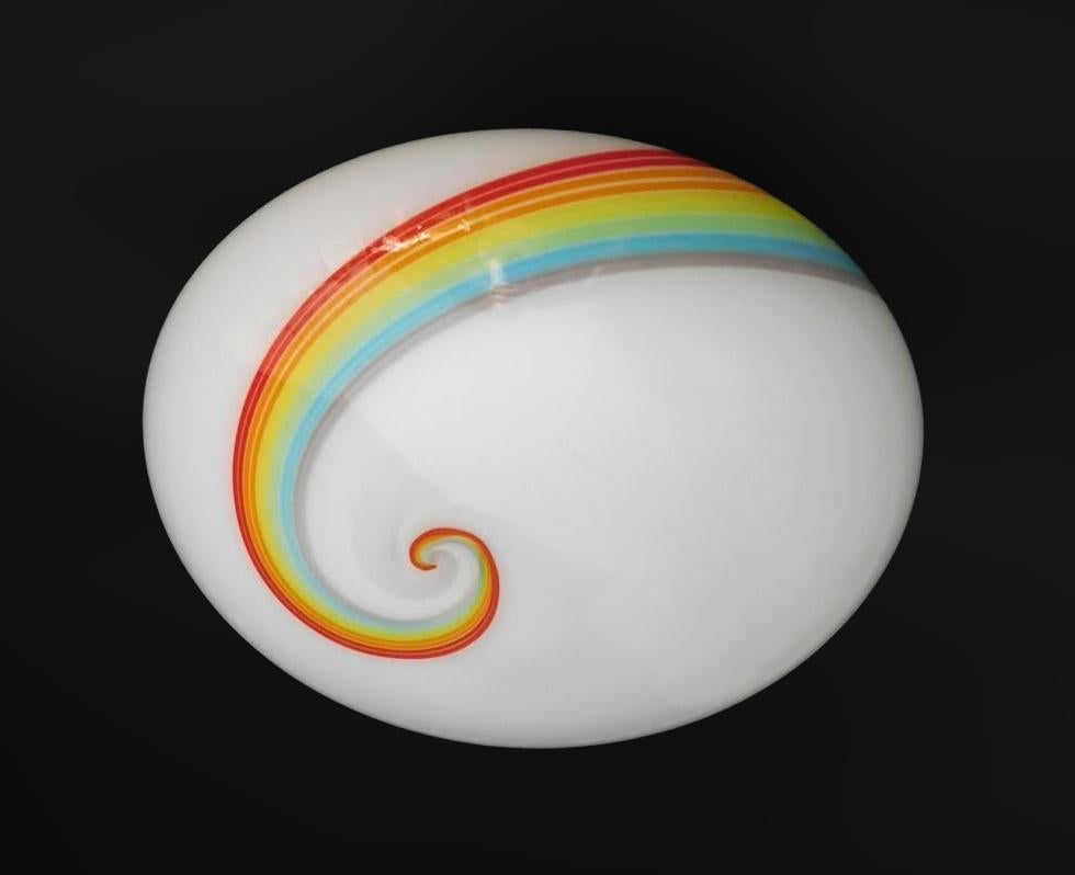 Vintage Italian flush mount or wall sconce with a frosted white Murano glass shade and a swirl stripe in the colors of rainbow / Made in Italy in the style of Vistosi, circa 1960s 
Measures: diameter 16 inches, height 7 inches
1 light / E26 or E27