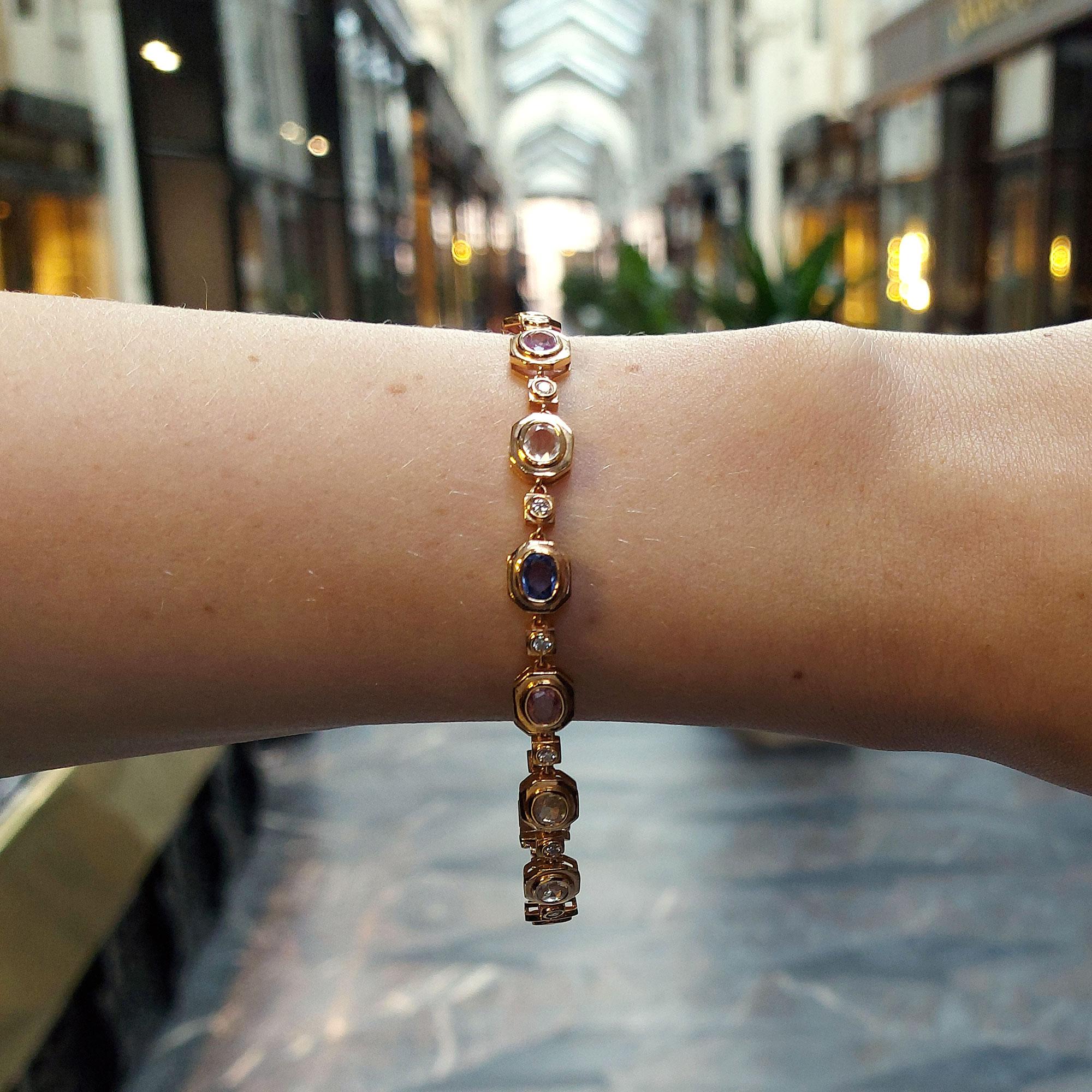 Total carat weight of the sapphires is approximately 4.62 carats. The total diamond weight is exactly 0.42 carats.
A beautiful rainbow sapphire and diamond bracelet set in 18 carat rose gold. 
The bracelet is comprised of a range of dark blue, dark