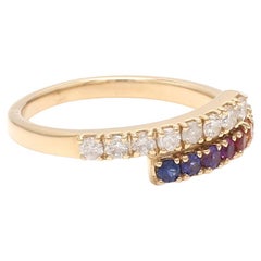 Anillo giratorio de zafiro arco iris y diamantes de 18 quilates