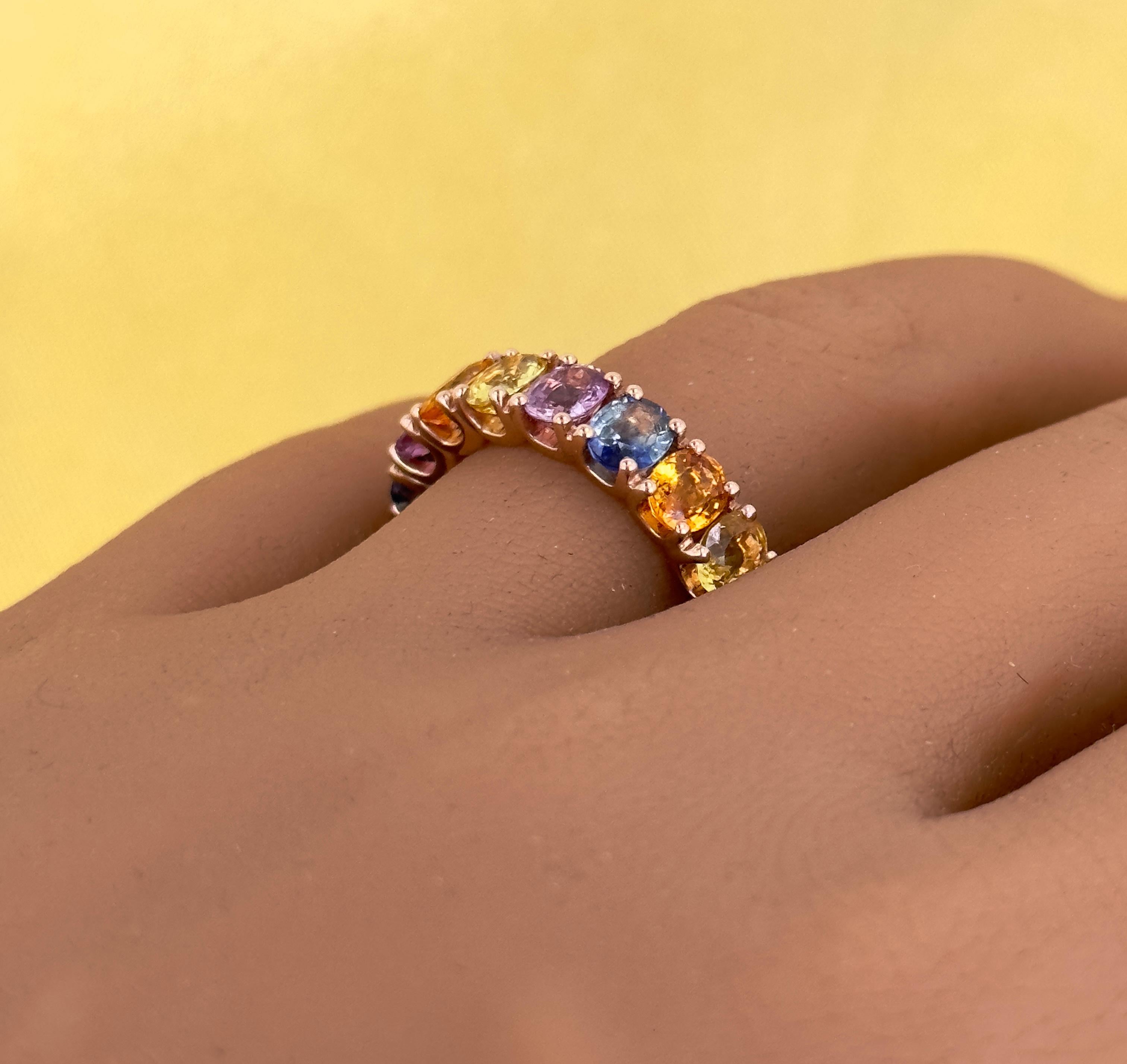 A fine collection of rainbow rings! The unified color of rose gold mixed with a combination of fancy sapphires! Genuine rainbow sapphire colors include orange, yellow, pink, blue, and green! Our rings are made in 14k and 18k rose gold with a basket