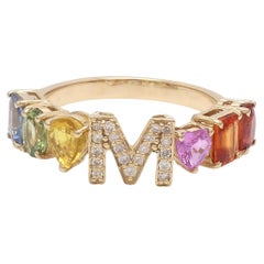 Anillo de oro de 18 quilates con nombre e inicial de zafiro arco iris