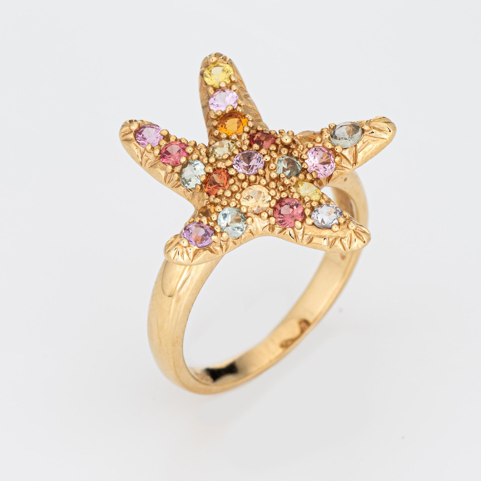 Stylish vintage multi-colored sapphire starfish ring crafted in 14 karat yellow gold. 

Multi-colored sapphires (green, yellow, orange & pink) total an estimated 0.65 carats. 

The colorful sapphires are set into the ornate starfish mount. The