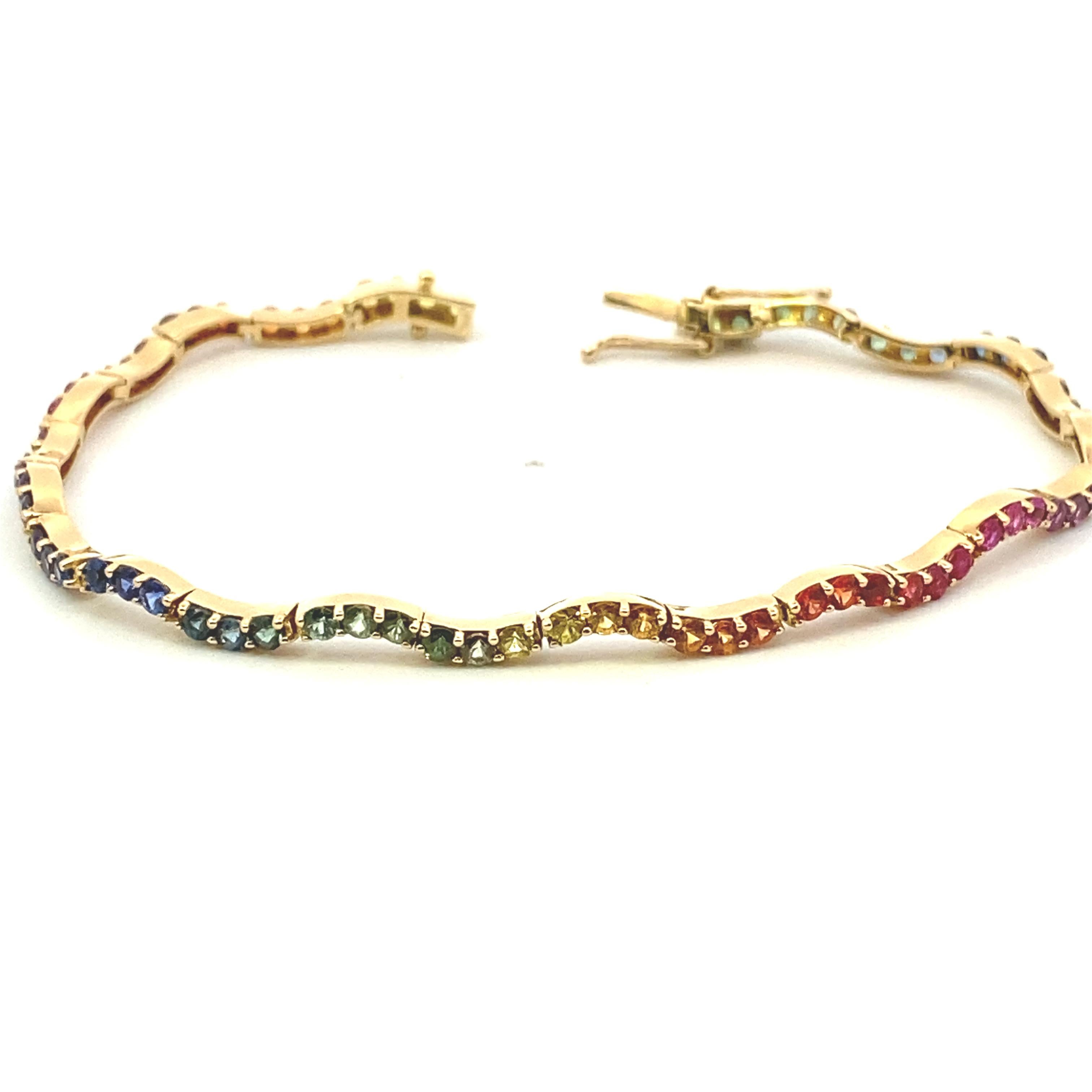 Rainbow Sapphire Yellow Gold Wavy Tennis Bracelet In Good Condition For Sale In DALLAS, TX