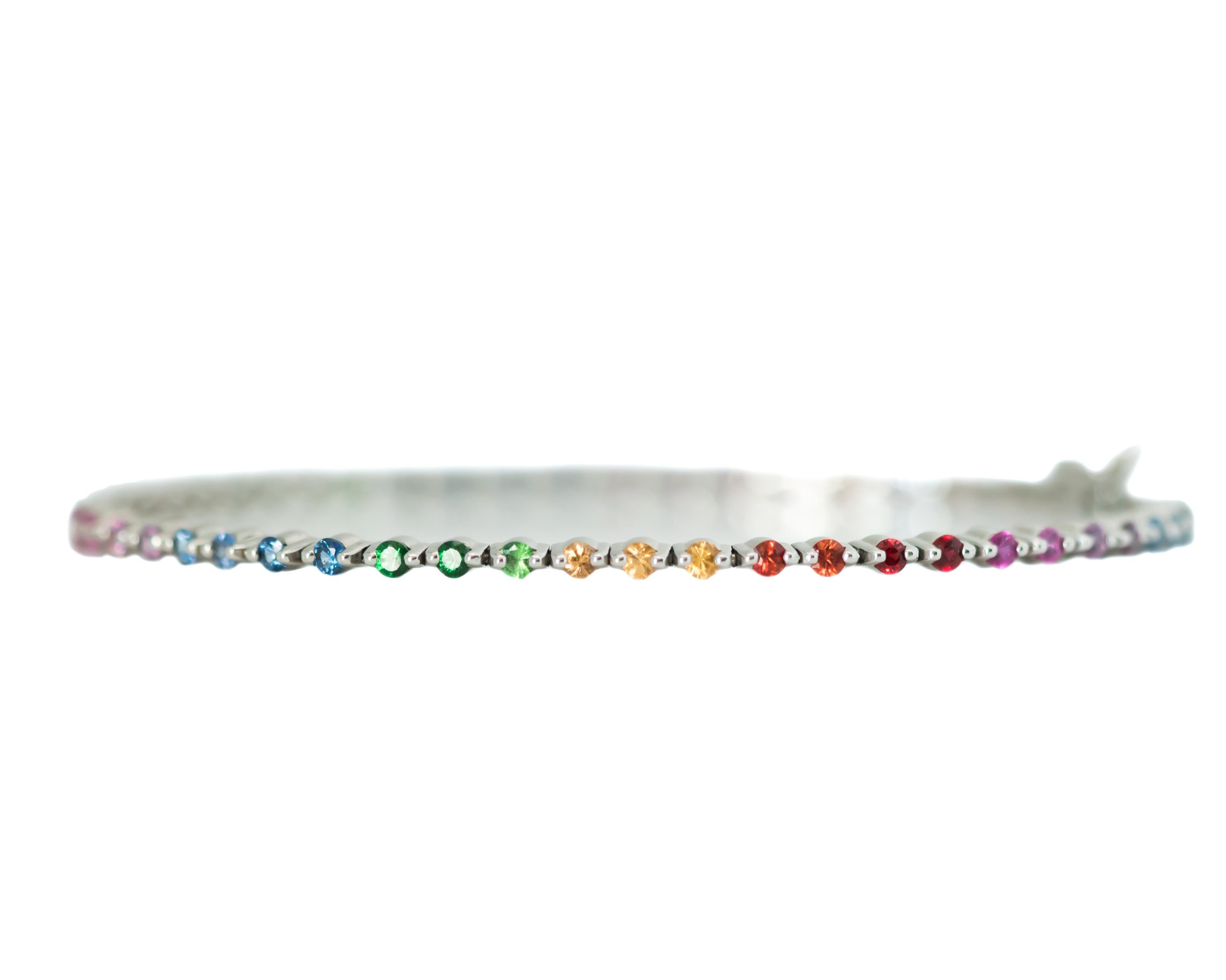 New Rainbow Sapphire Tennis Bracelet - 18 Karat White Gold, Sapphires

Features:
2.3 carat total round sparkling Sapphires
Prong Set Colored Sapphires
18 Karat White Gold Setting
Sapphire colors include shades of green, blue, purple, pink, red,