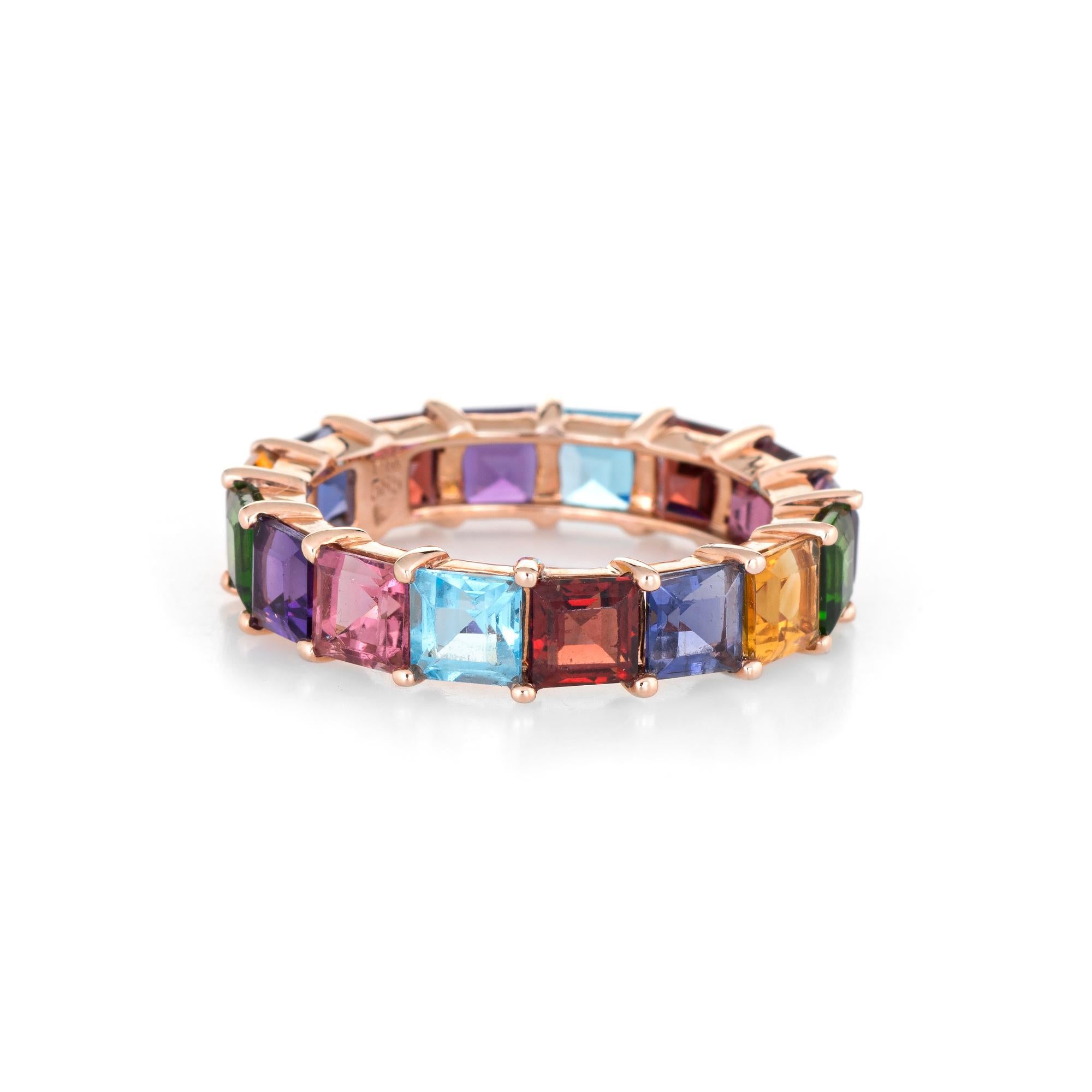 Elegant estate rainbow eternity band crafted in 14 karat rose gold. 

Square emerald cut stones (blue topaz, garnet, amethyst, pink & green tourmaline & iolite) are estimated at 0.50 carats each, totaling an estimated 8 carats. The stones are in