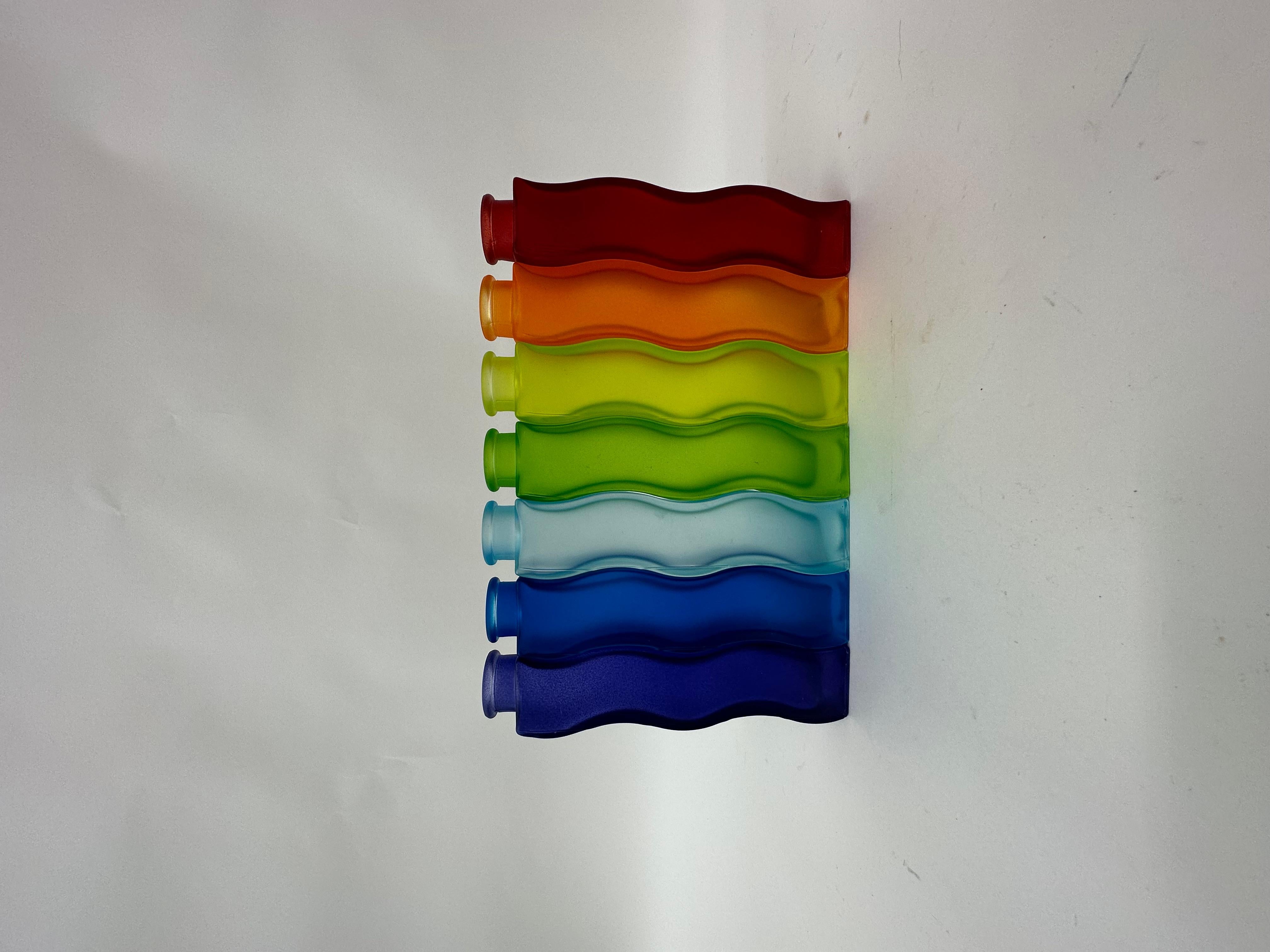 Rainbow set of 7 Vintage Ikea Wave Squiggle Skämt vases , 1990’S

Dimensions:  21 cm H , 4,5cm W, 4,2cm W
Condition: Good ( Some have small scratches or damages on the surface)
Period: 1990’s