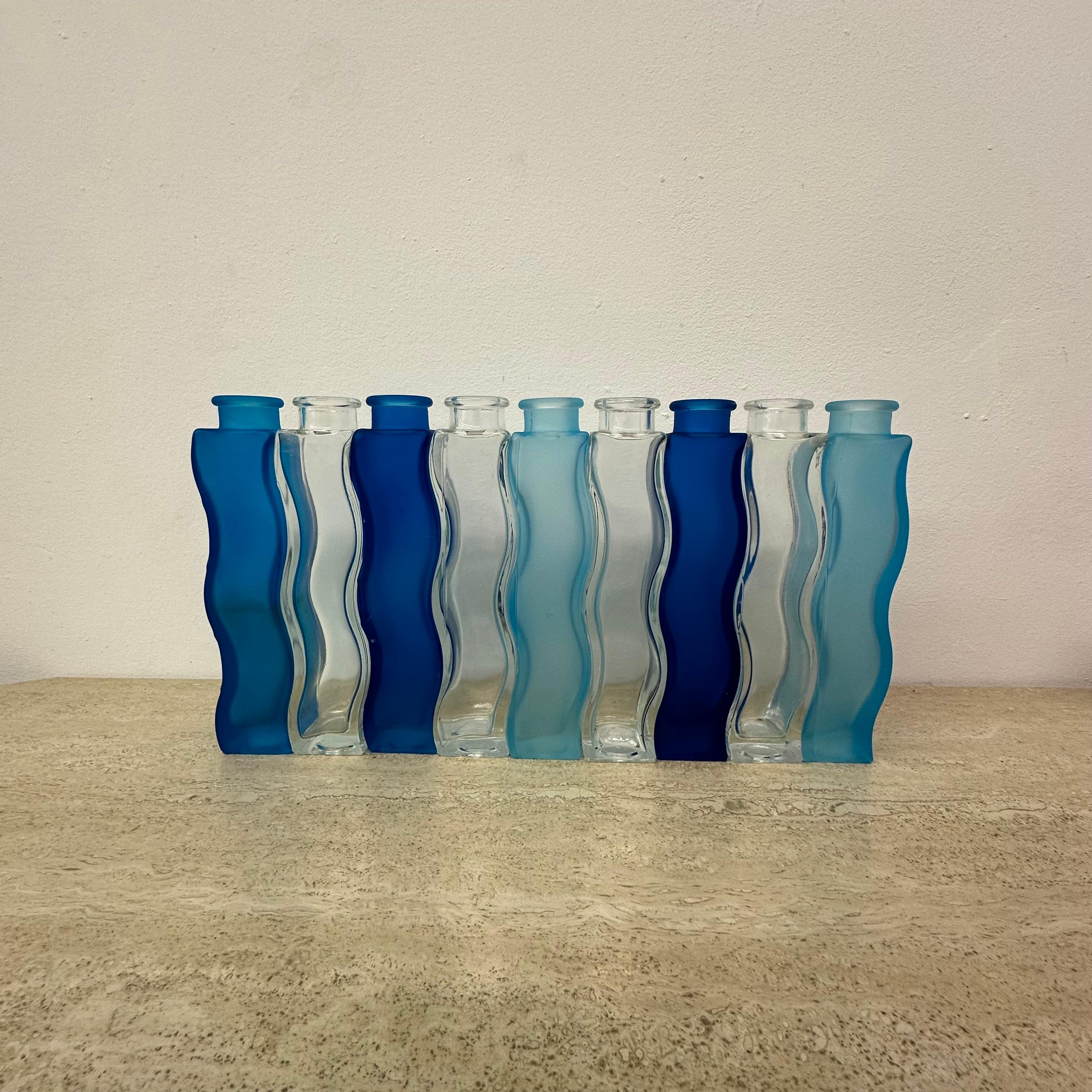 Rainbow set of 9 Vintage Ikea Wave Squiggle Skämt vases , 1990’s

Dimensions:  21 cm H , 4,5cm W, 4,2cm W
Condition: Good ( Some have small scratches or damages on the surface)
Period: 1990’s
