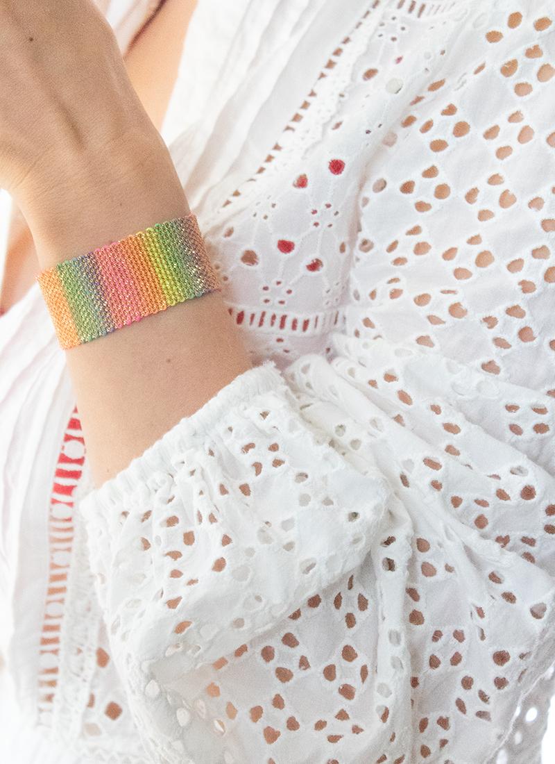 Exquisitely made, this intricate cuff is weaved on an antique style loom into a unique colorful design. It is made with 18ct Gold Vermeil on sterling silver and neon rainbow coloured Silk. You can wear it on its own as a fun & luxurious statement