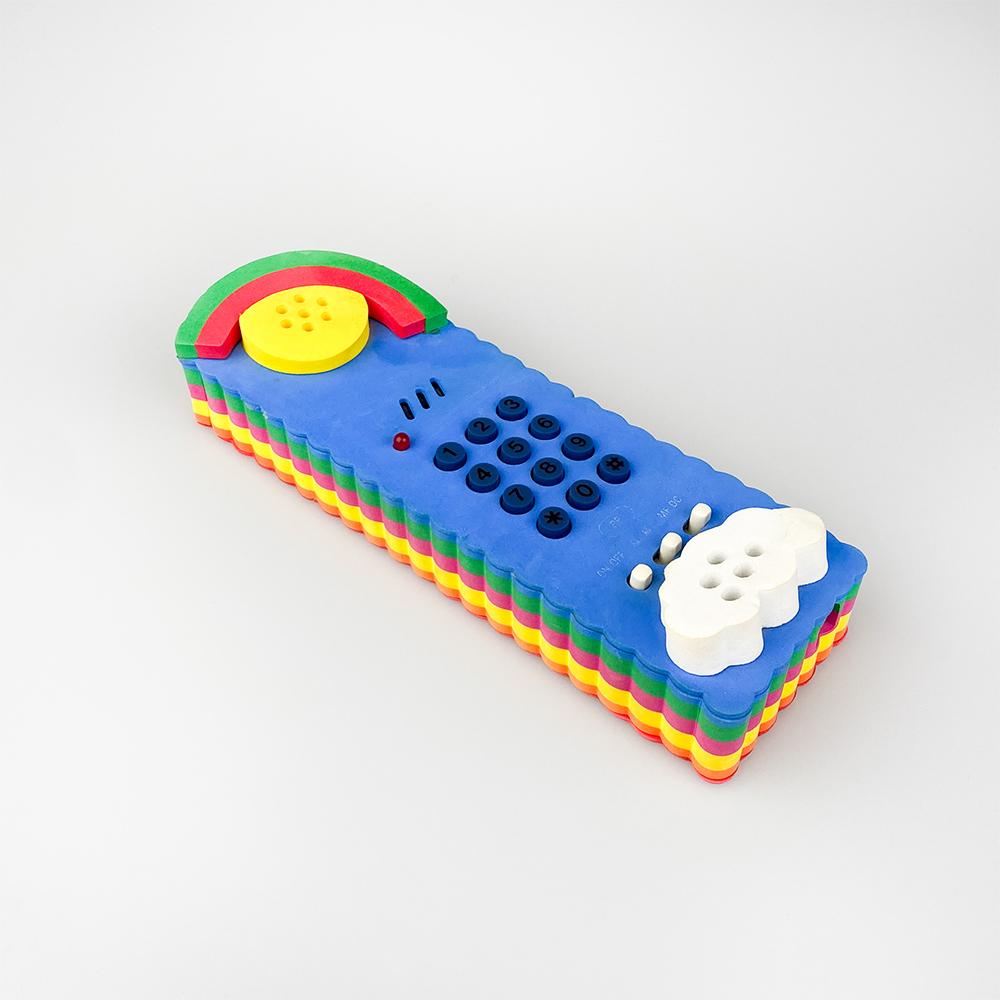 Rainbow SP019 Softphone, design by Canetti Group for Canetti.

Made of multicolored foam.

Has some wear to bottom buttons.

Measures: 22x7x3 cm.