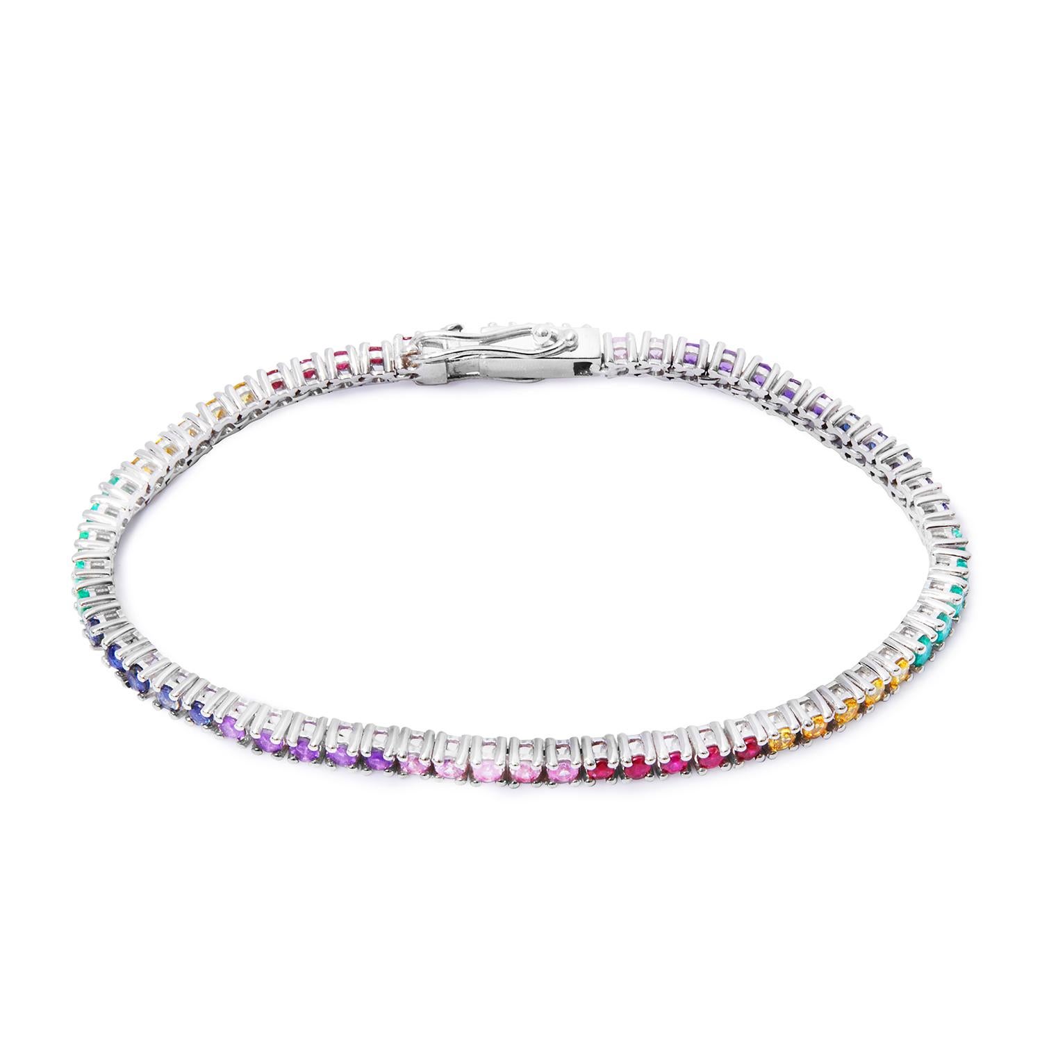 A colourful version of a classical and timeless piece, both precious and playful. Single row tennis bracelet with multicolour natural stones and secure clasp. Minimalistic design made of white gold and precious coloured stones with healing
