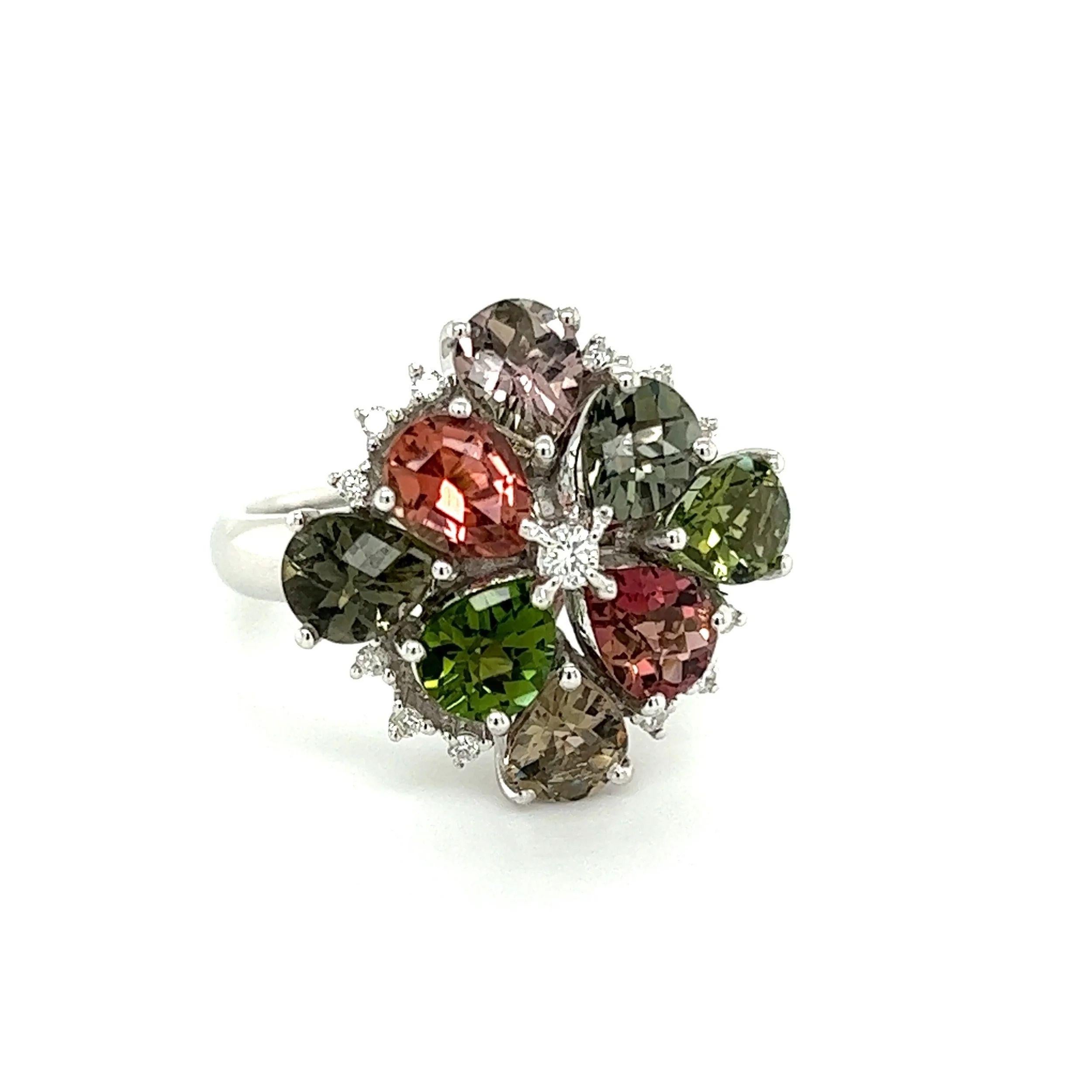 Simply Beautiful! Rainbow Tourmaline and Diamond Vintage Gold Cluster Ring. Securely Hand set with Tourmaline Gemstones, weighing approx. 4.55tcw and Diamonds, approx. 0.16tcw. The ring is Hand crafted in 18K White Gold. Measuring approx. 1.16” L x
